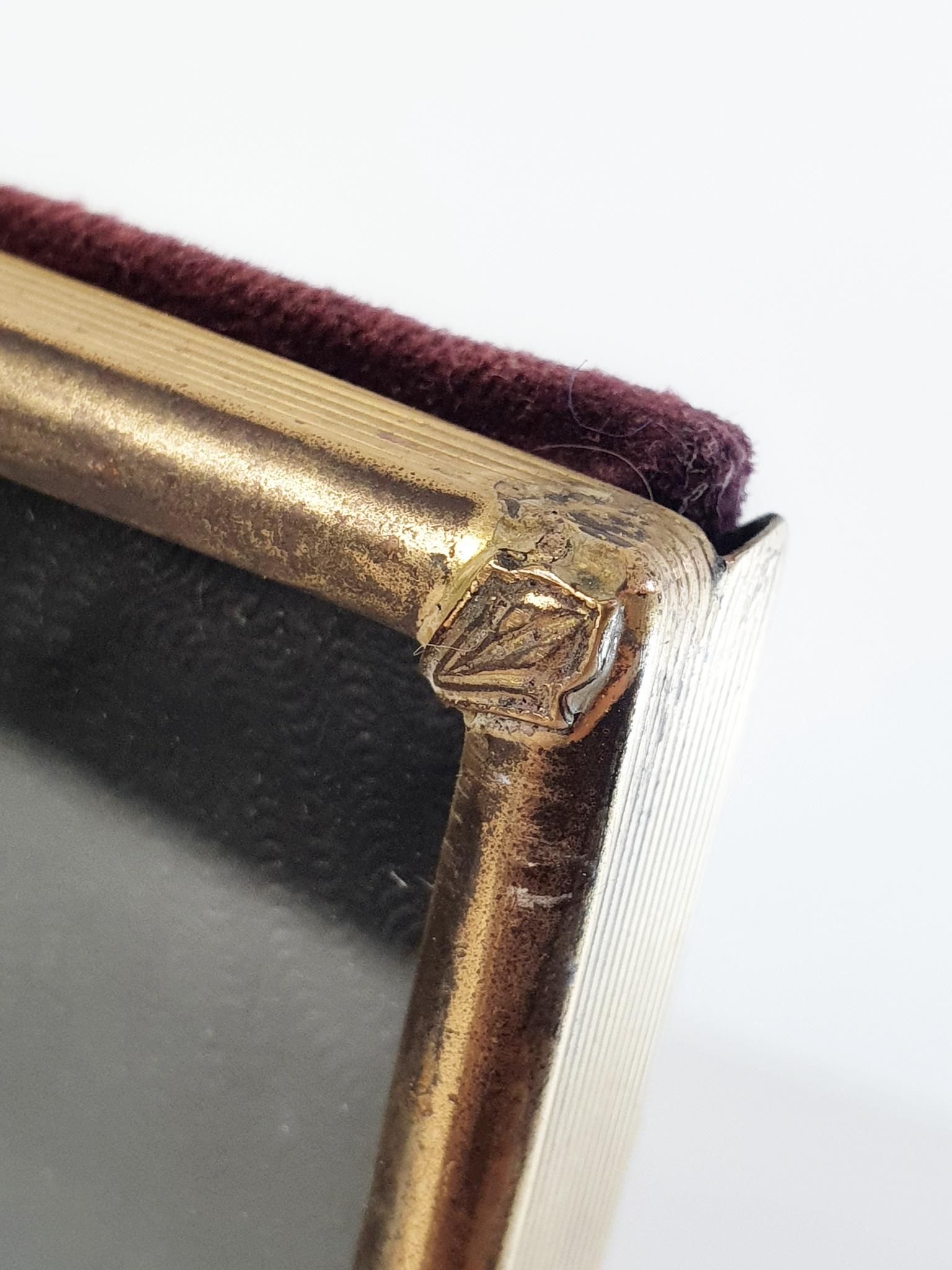 An antique decorative photo/picture frame in brass in Italian Liberty Style from the early 1900's. In good condition with natural patina. This frame has a double hinge system which means you can open and fold the frame 180 degrees which means you