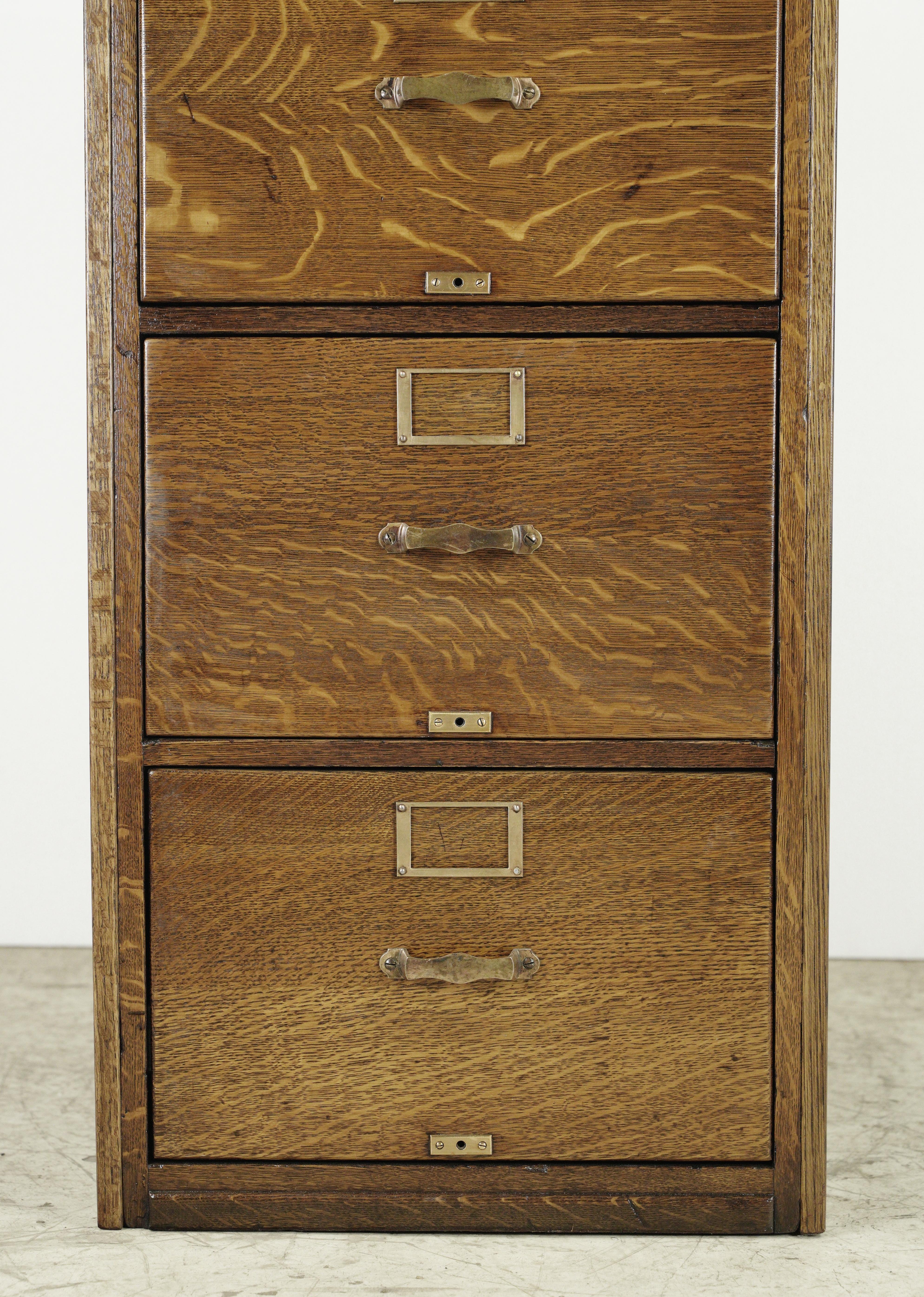 Dark tone oak filing cabinet with the original brass hardware and new steel drawer slides. Made by Library Bureau Sole Makers. Good condition, with minor dents and scratches on the brass. One available. Please note, this item is located in our