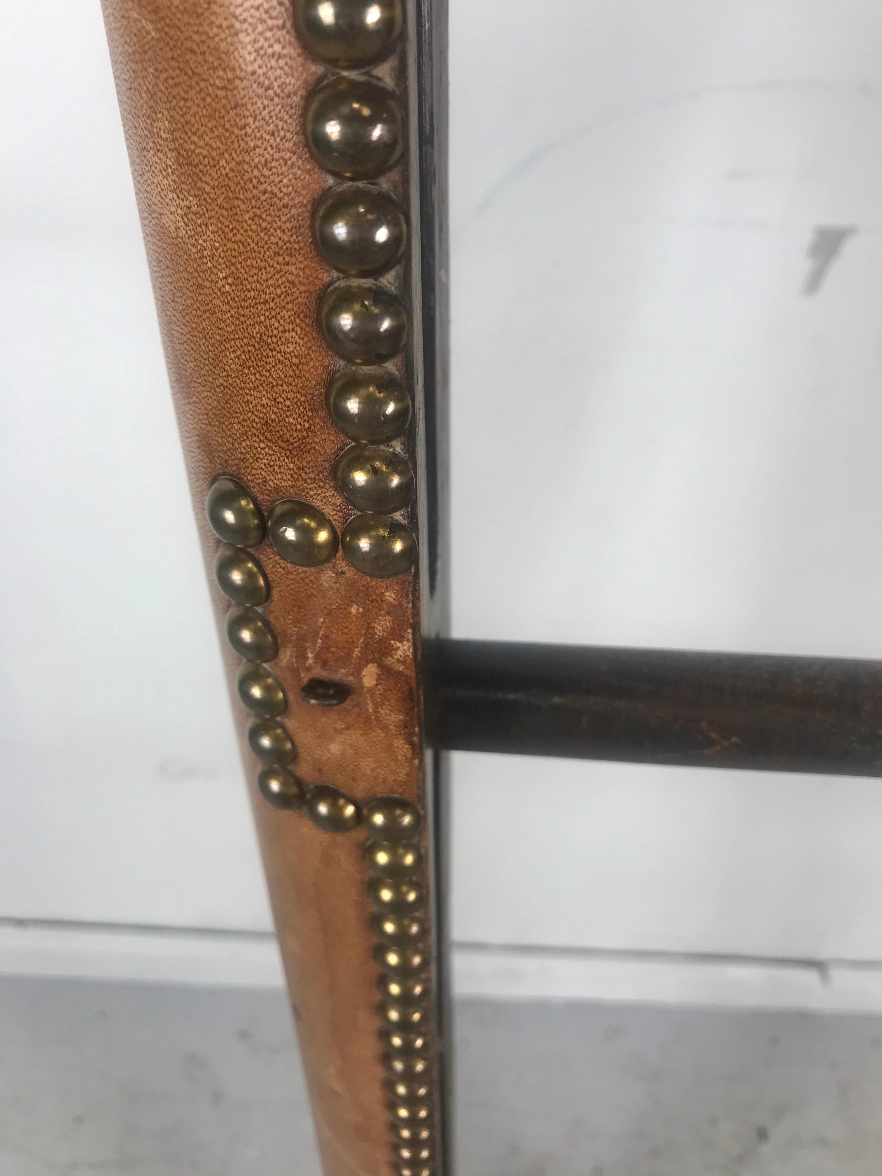 Antique English library folding pole ladder covered in luggage-colored leather with brass nailheads and having six rungs.
The closed height dimensions are 90.5