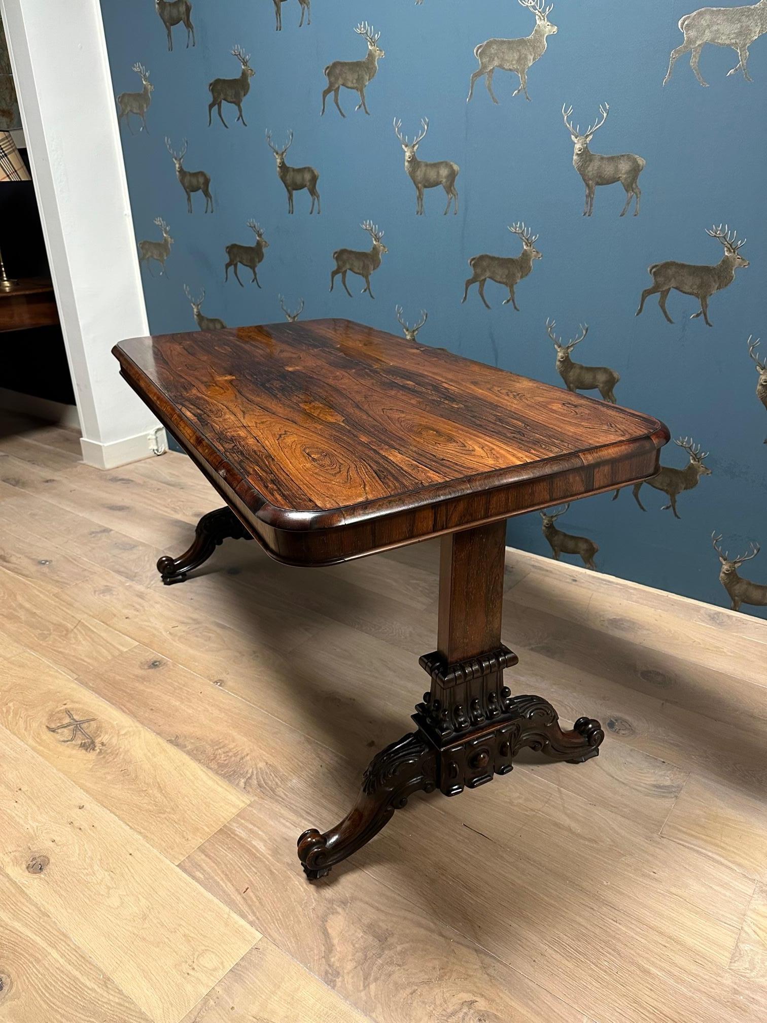 Beautiful antique rosewood library table in perfect and completely original condition. Beautiful drawing of the rosewood and impressive table legs. The table can be used for multiple purposes. As a free-standing writing table, console table or small