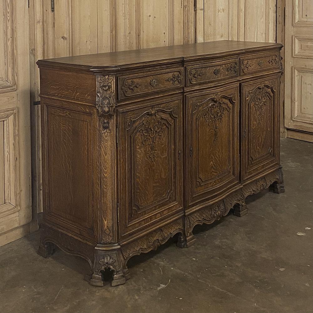 Antique Liegoise Louis XIV buffet is a splendid example of the superior quality and craftsmanship for which the region has been known for centuries! Utilizing old-growth oak, the casework was designed with rounded corners and a step-front center
