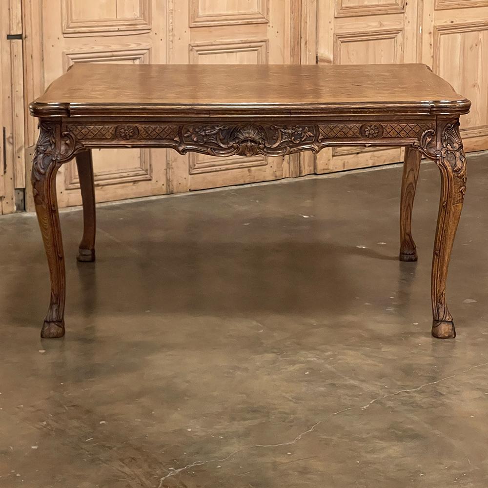 Antique Liegoise Louis XIV Draw Leaf Dining Table is a superlative example of the high quality furnishings that have been produced in the region for centuries! The clever design has two leaves that tuck into slots underneath the main table top when