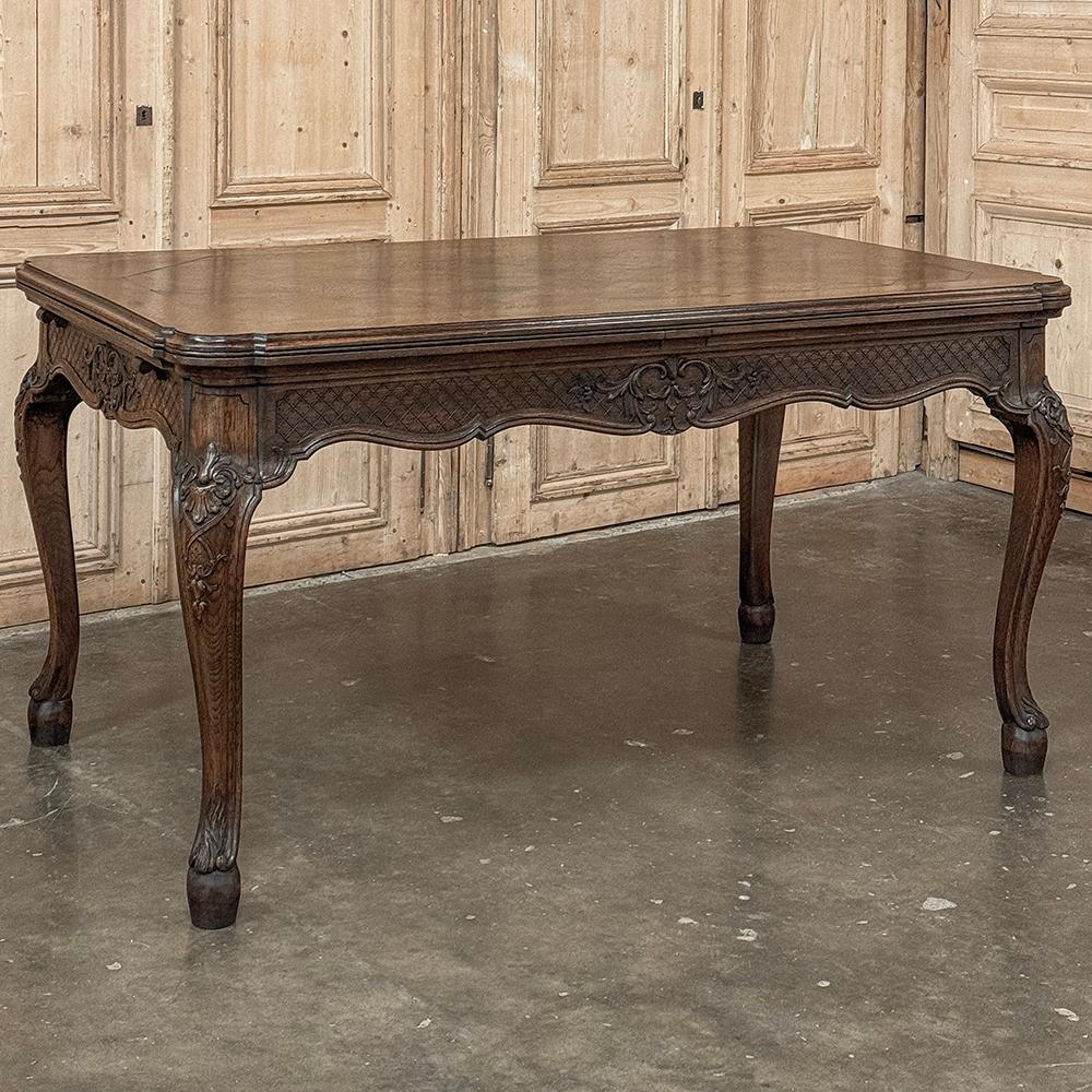 Antique Liegoise Louis XIV draw leaf dning table is a superlative example of the high quality furnishings that have been produced in the region for centuries! The clever design has two leaves that tuck into slots underneath the main table top when