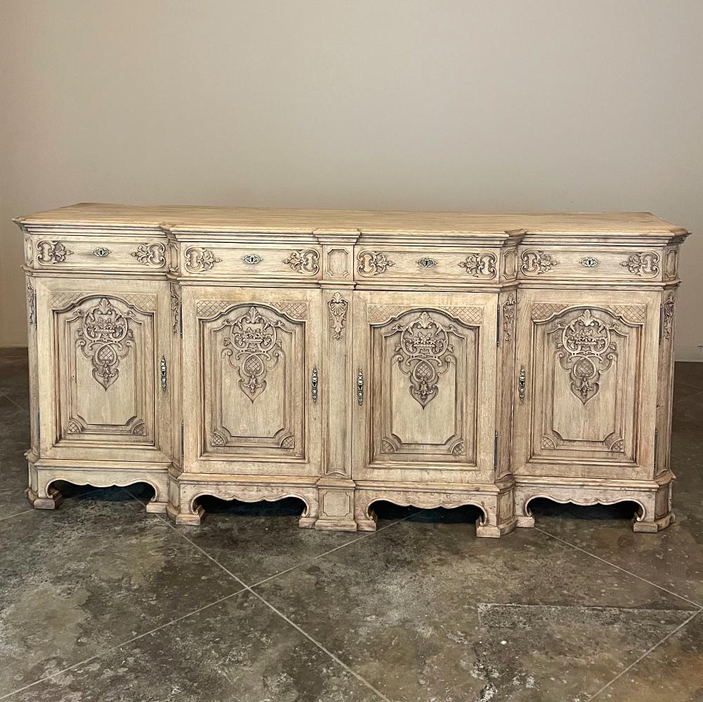 Antique Liegoise Louis XIV style Buffet in stripped oak is a magnificent work of the cabinetmaker's art! The architecture is complex, with a step-front center section and four recessed and rounded cornerposts on the front, creating visual appeal