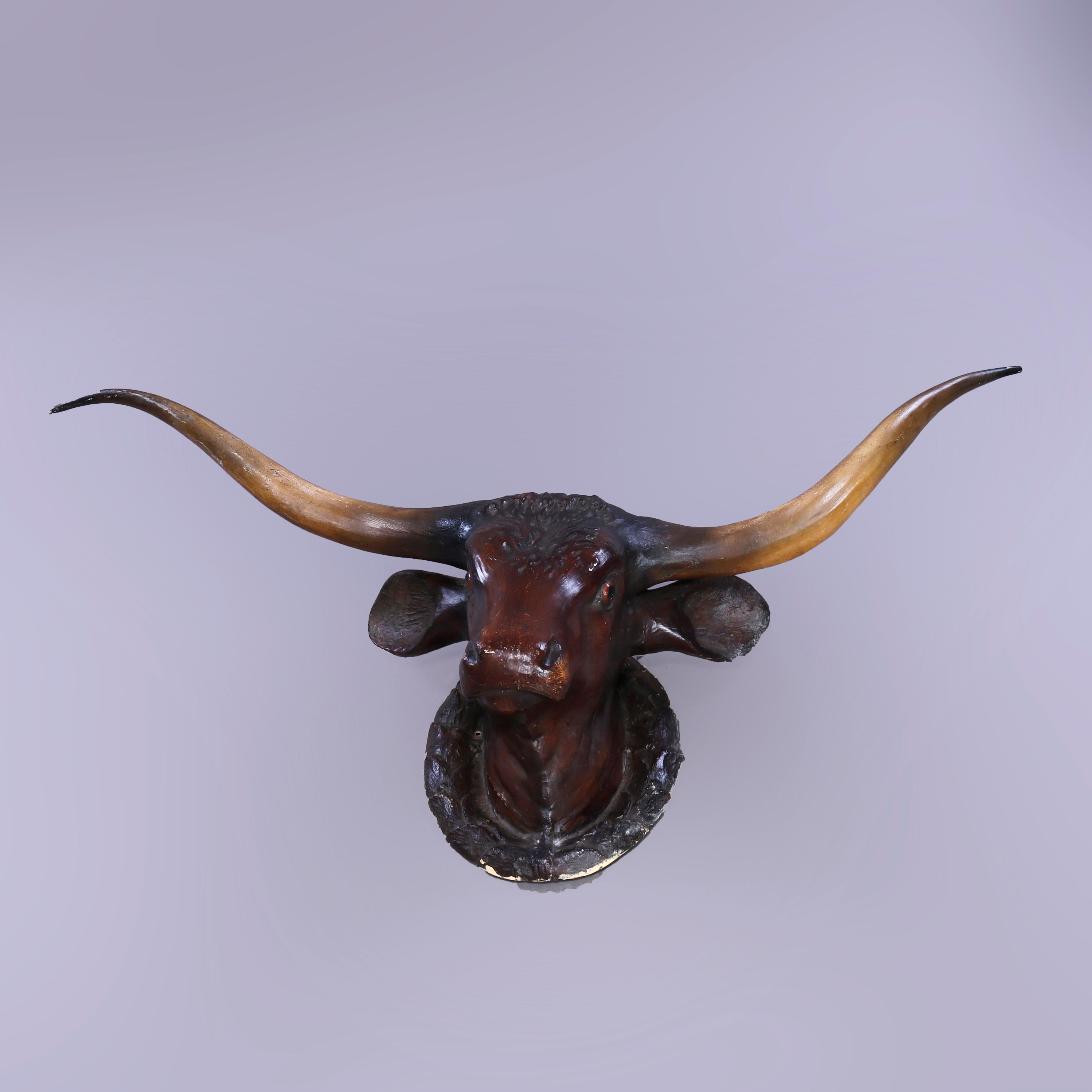 An antique advertising livestock mount offers life size paper mache wall mount of a Texan long horned cow (cattle), c1920

Measures - 32'' H x 62.5'' W x 24'' D.