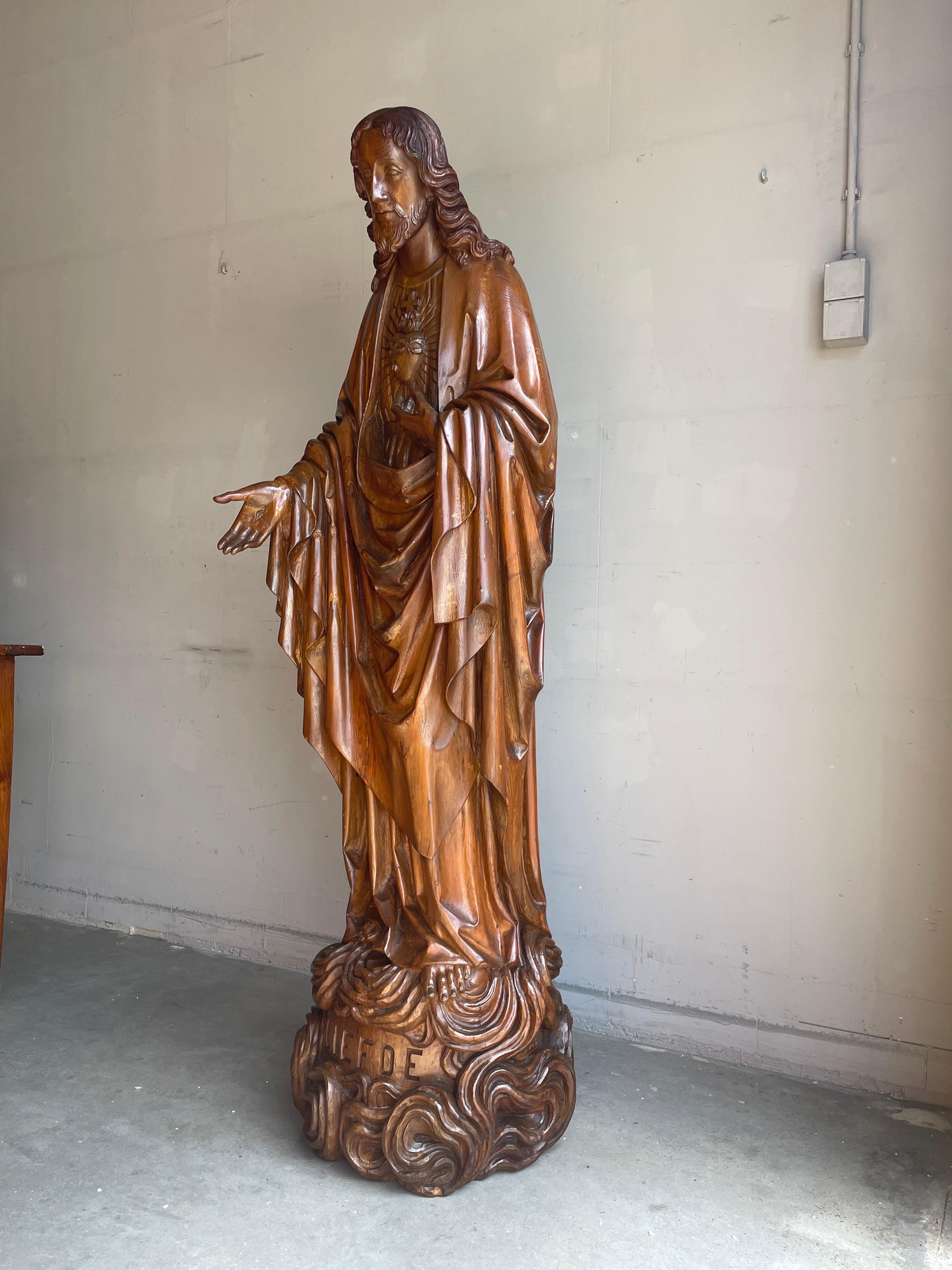 Stunning wooden Holy Heart of Christ statue by Dutch master carver H. van der Geld (1838-1914).

The art of carving sculptures out of wood was passed on for many centuries and we feel that the last generation of master carvers died out in the early