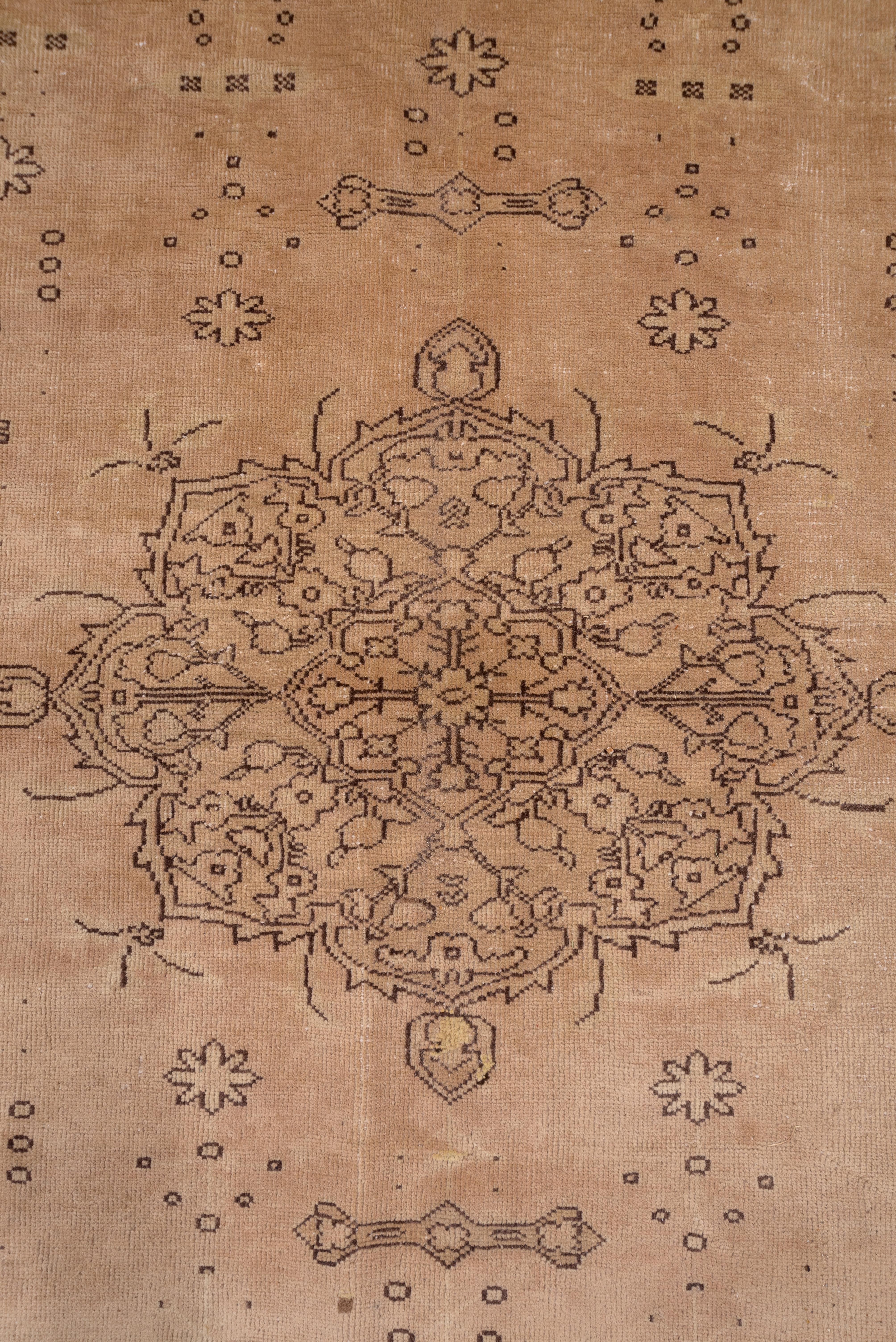 The light peachy- tan field is centred by a small ivory-beige medallion with matching corner pieces. Dark brown outlined small flowers are scattered symmetrically about. There are numerous simply figured borders with brown outlines.