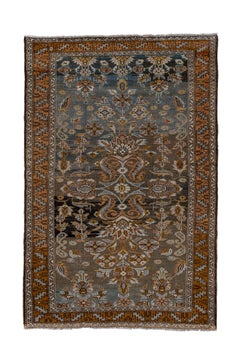 Tappeto antico Lilian, con campo di ardesia e disegno a rosette, circa 1930