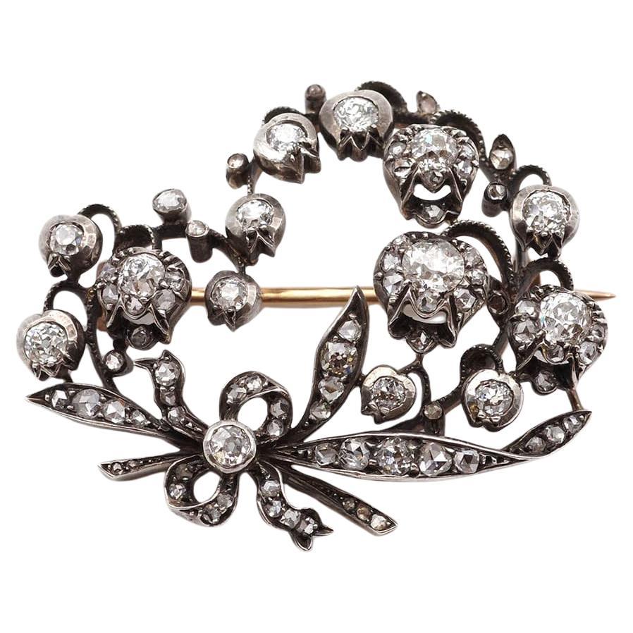 Broche ancienne en or 18 carats et argent, ornée d'un muguet et d'un diamant de 3cts