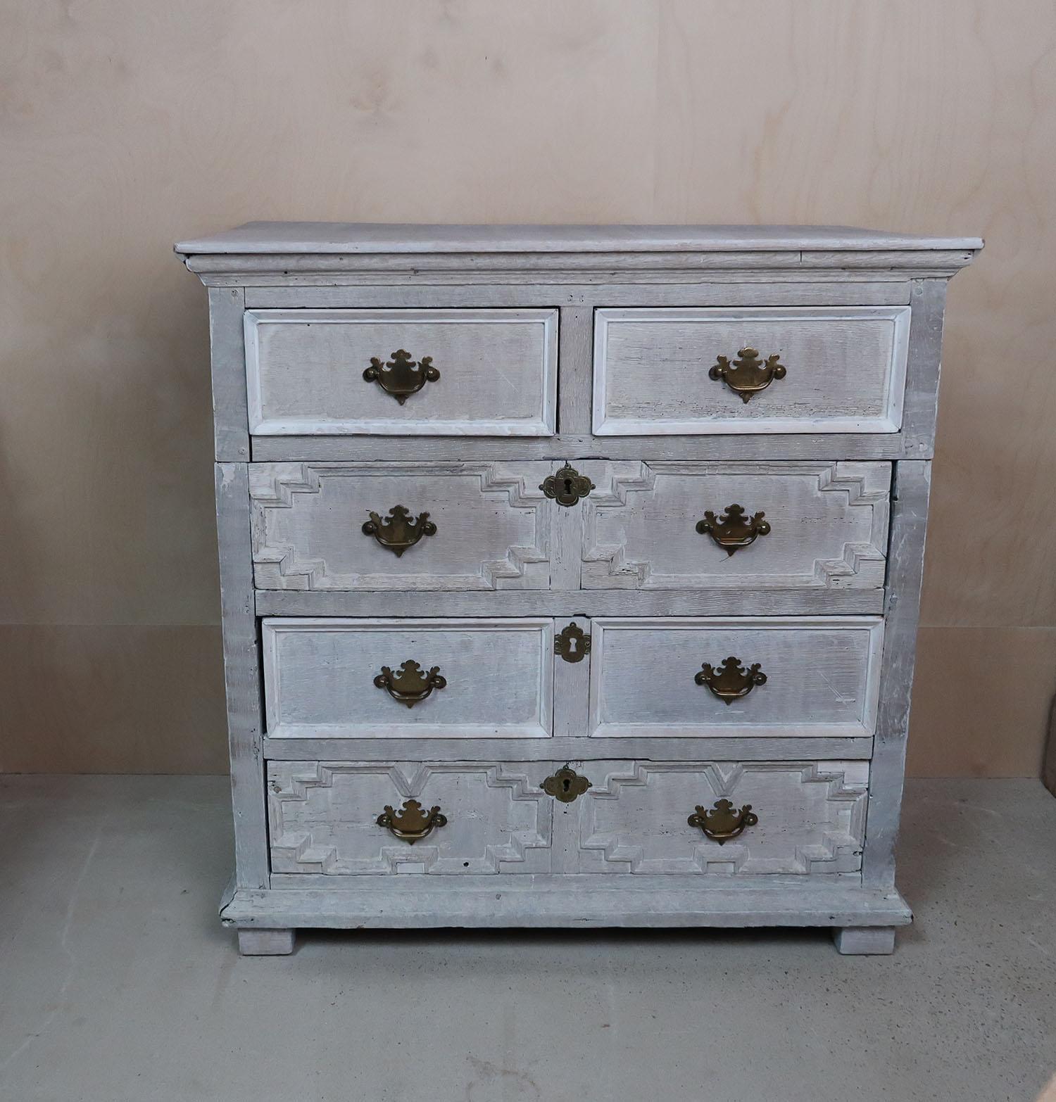 Very decorative chest of drawers.

Solid oak. Recently limed.

Basically a late 17th century chest of drawers with many later modifications*.

*Later moulding to the two plain drawers.

Replaced side and back panels.

2 Cuts in the