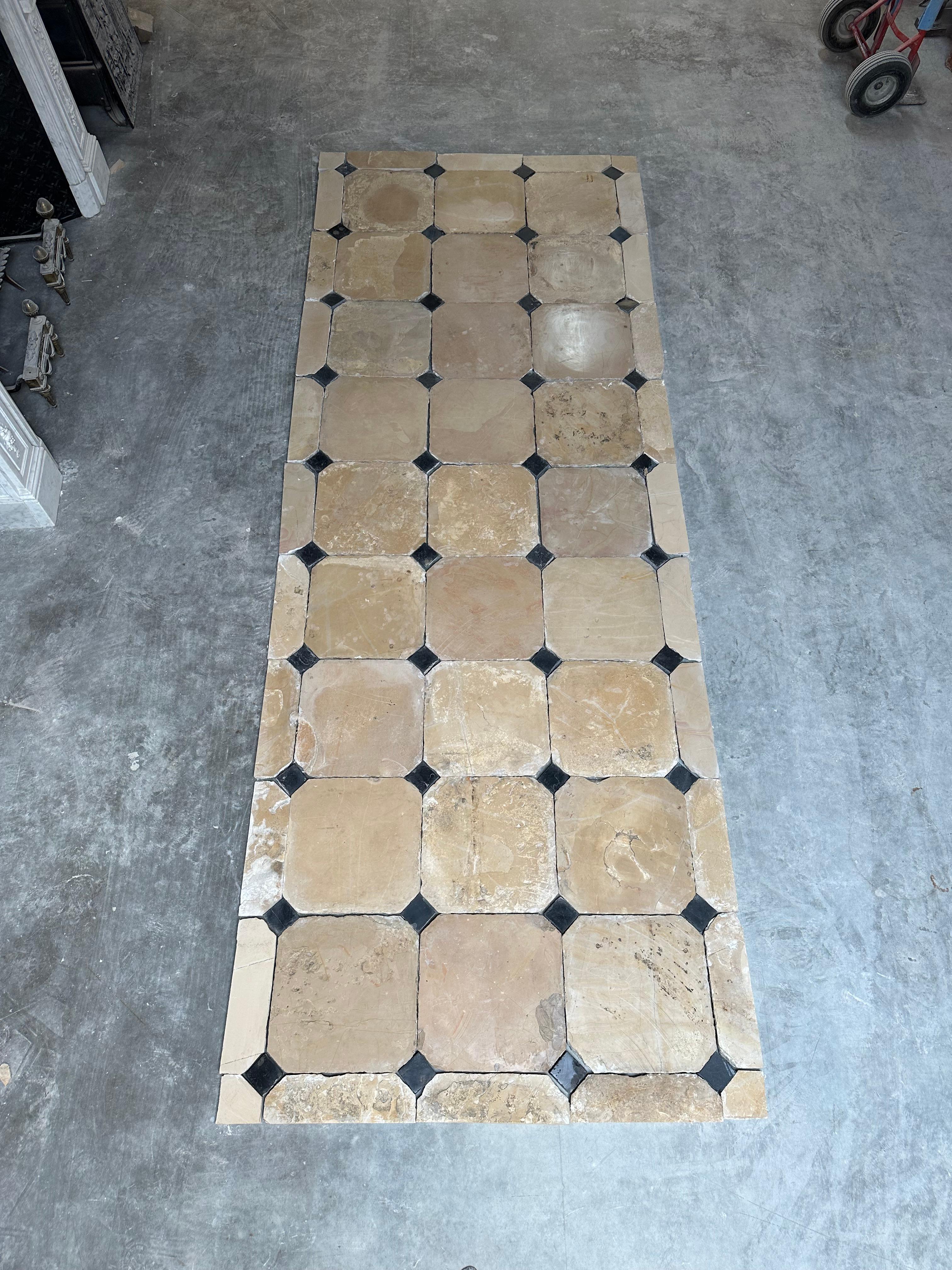 Happy to offer this beautiful French limestone cabochon floor.
This used to be the hallway between two room in a nice mansion in the Burgundy area in France.

Soft and warm colored limestone tiles show perfect imperfections that make these floors so