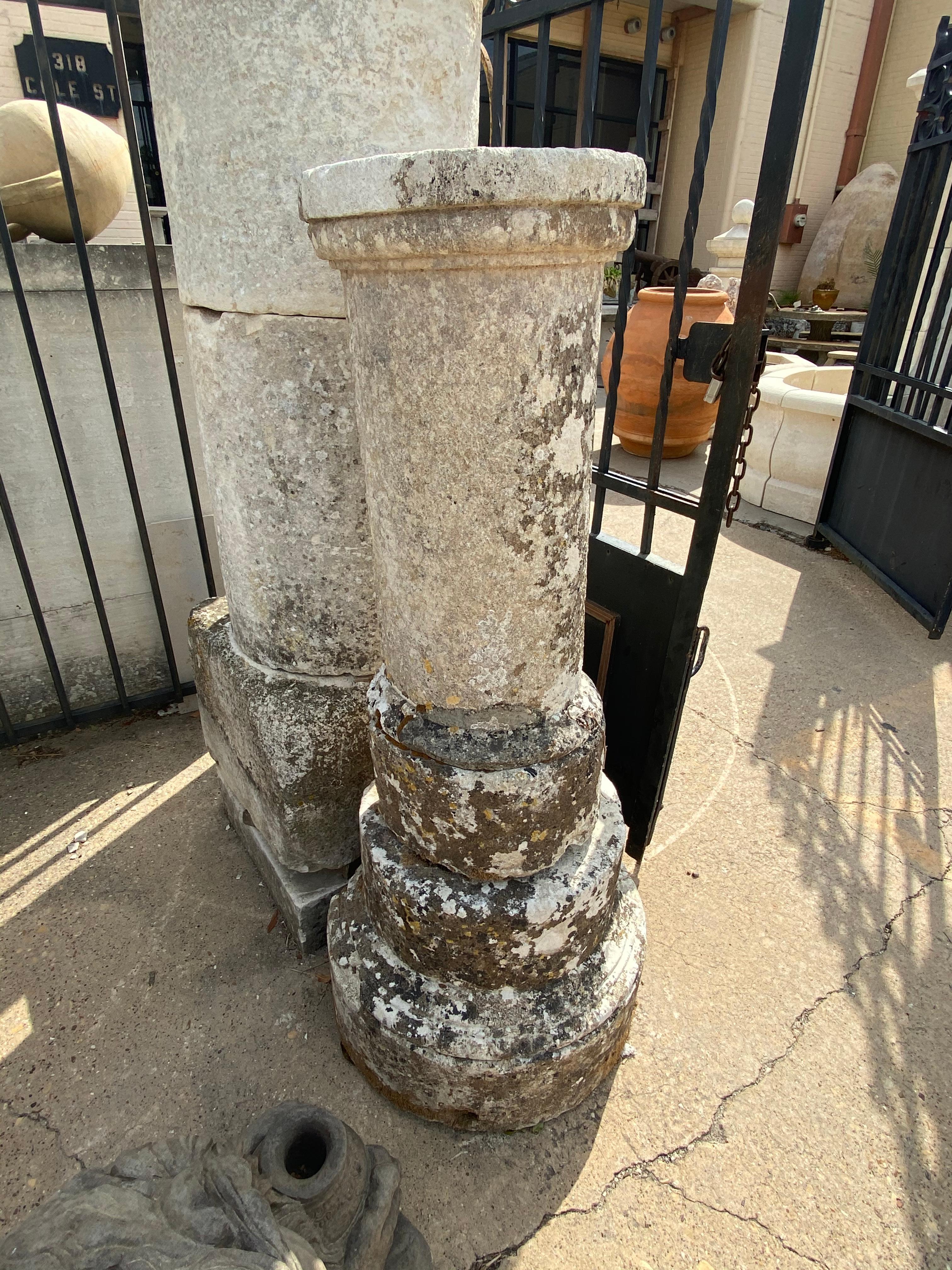 Antique limestone columns. 

Origin: France, circa 1600. 

Measurements: 56.25'' H x 22.5'' W x 19'' D
