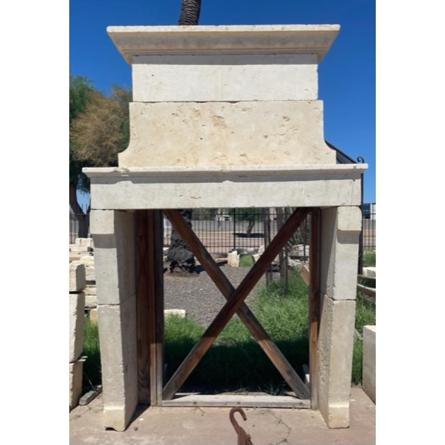 Antique Limestone Fireplace with Trumeau
Dimensions: 
- Overall: 59 1/2” W x 31 1/4” D x 93 1/2” H
- Depth: Varies depending on installation.
- Interior firebox: 47 1/2” W x 51 ”H

Beautiful texture and patina.

Additional Information:  Damaged -