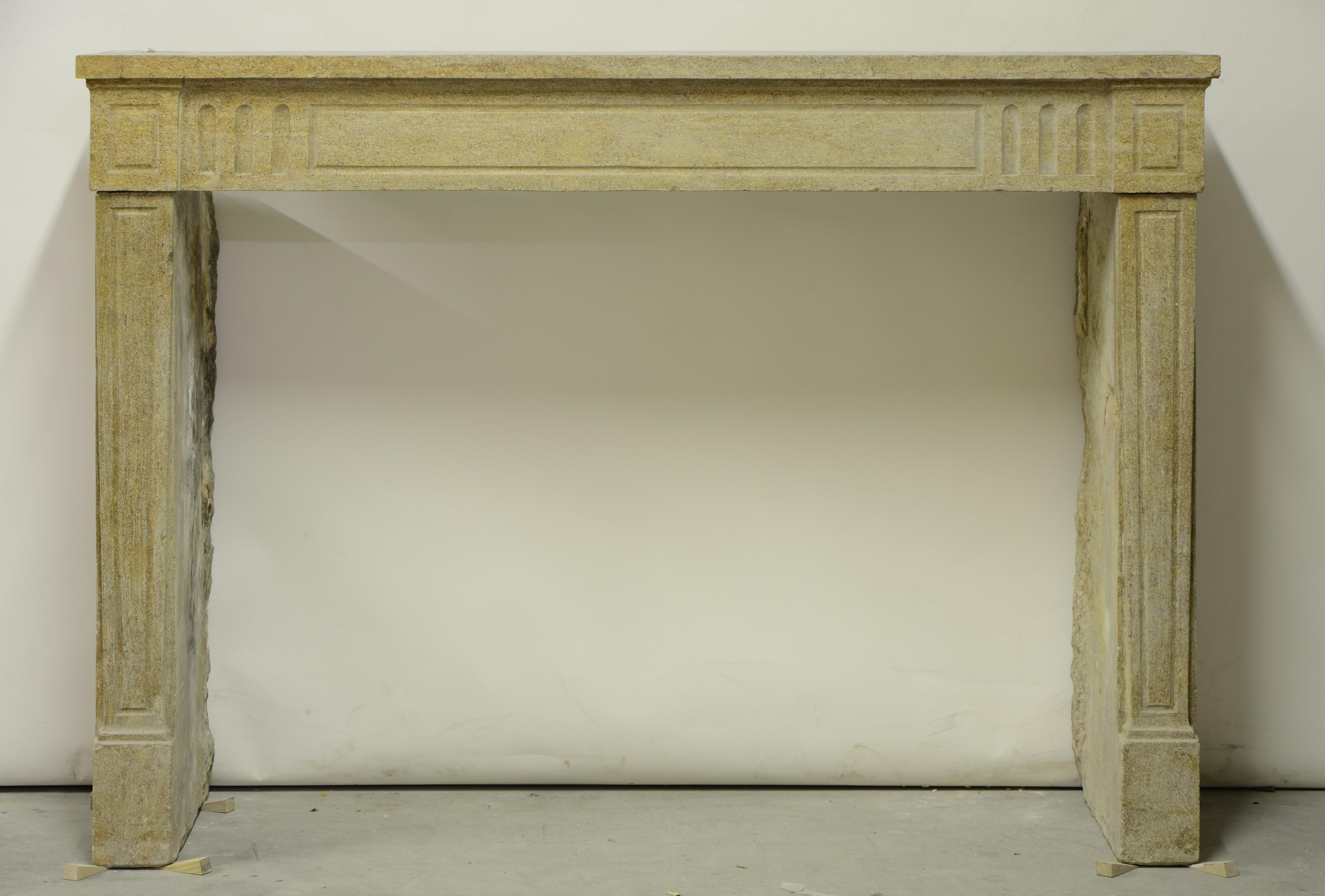 Nice simple, paneled Louis XVI from France.
This mantel is made from nice softened limestone from the Burgundy area. 

The interior dimensions are:
Height: 36.61 in. ( 93 cm.)
Width: 50.79 in. ( 129 cm.)

Nice patina and great usable