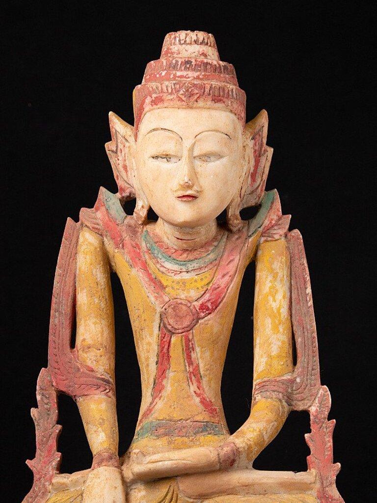 Material: Limestone
Material: wood
50,1 cm high 
31,5 cm wide and 9,4 cm deep
Weight: 8.913 kgs
Shan (Tai Yai) style
Bhumisparsha mudra
Originating from Burma
Early 19th century
Exceptional large, usually similar statues (if we would