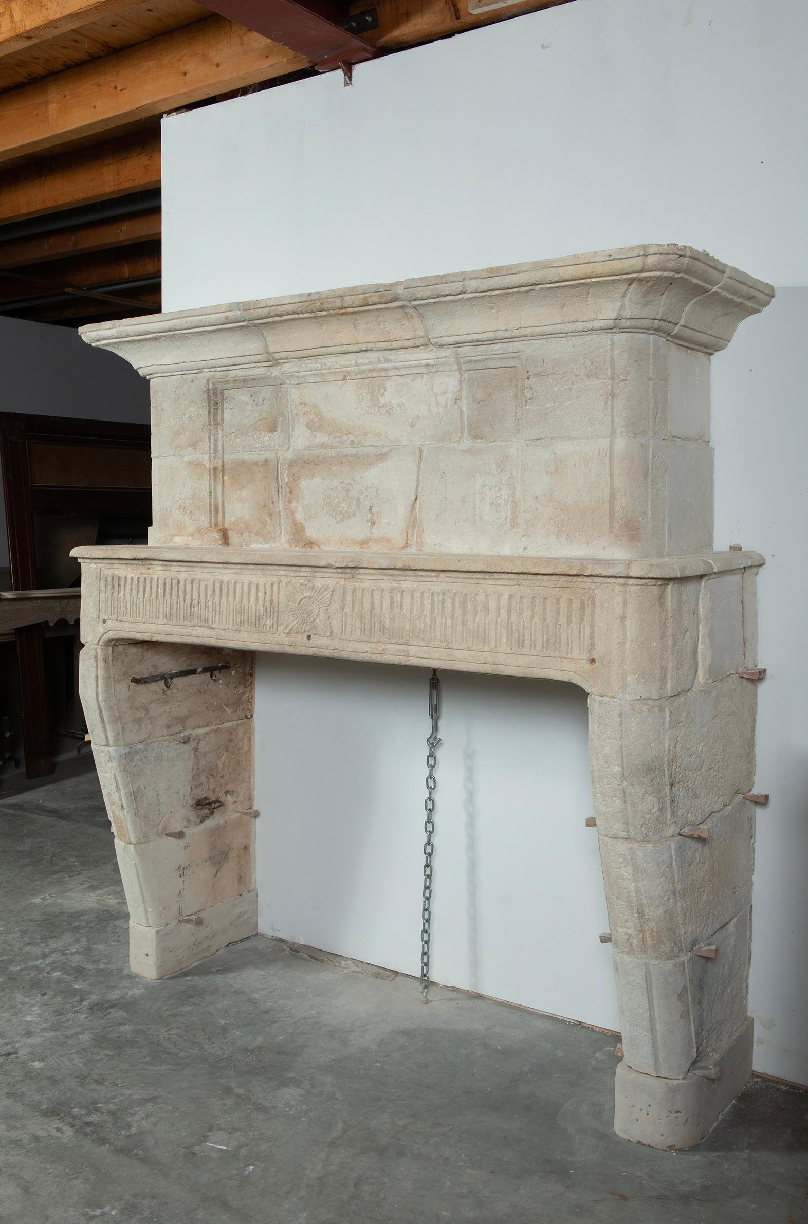 Very happy to be offering this rustic limestone trumeau fireplace mantel from the countryside of France.
This lovely seized mantel works as a show stopper in nearly any interior.
The decor, patina and material make this really stand out.

The strong