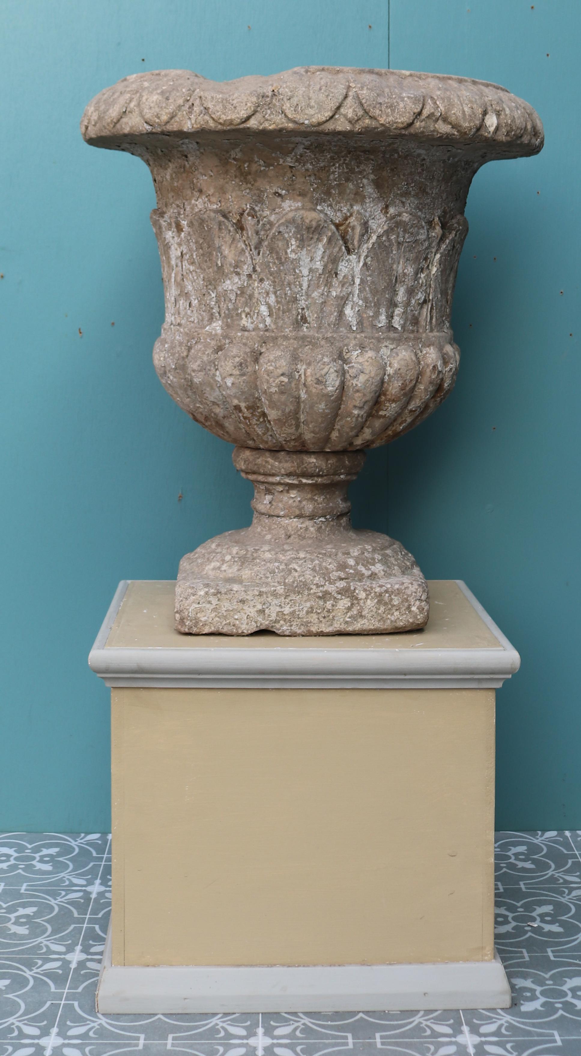 A single reclaimed limestone garden urn with gadrooning and carved decoration.

Additional dimensions:

Base 26 x 26 cm.