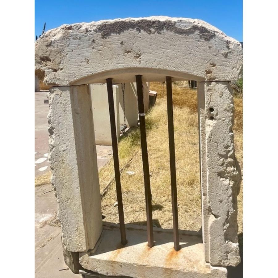 Antique Limestone Window Surround with Iron Bars In Distressed Condition For Sale In Scottsdale, AZ
