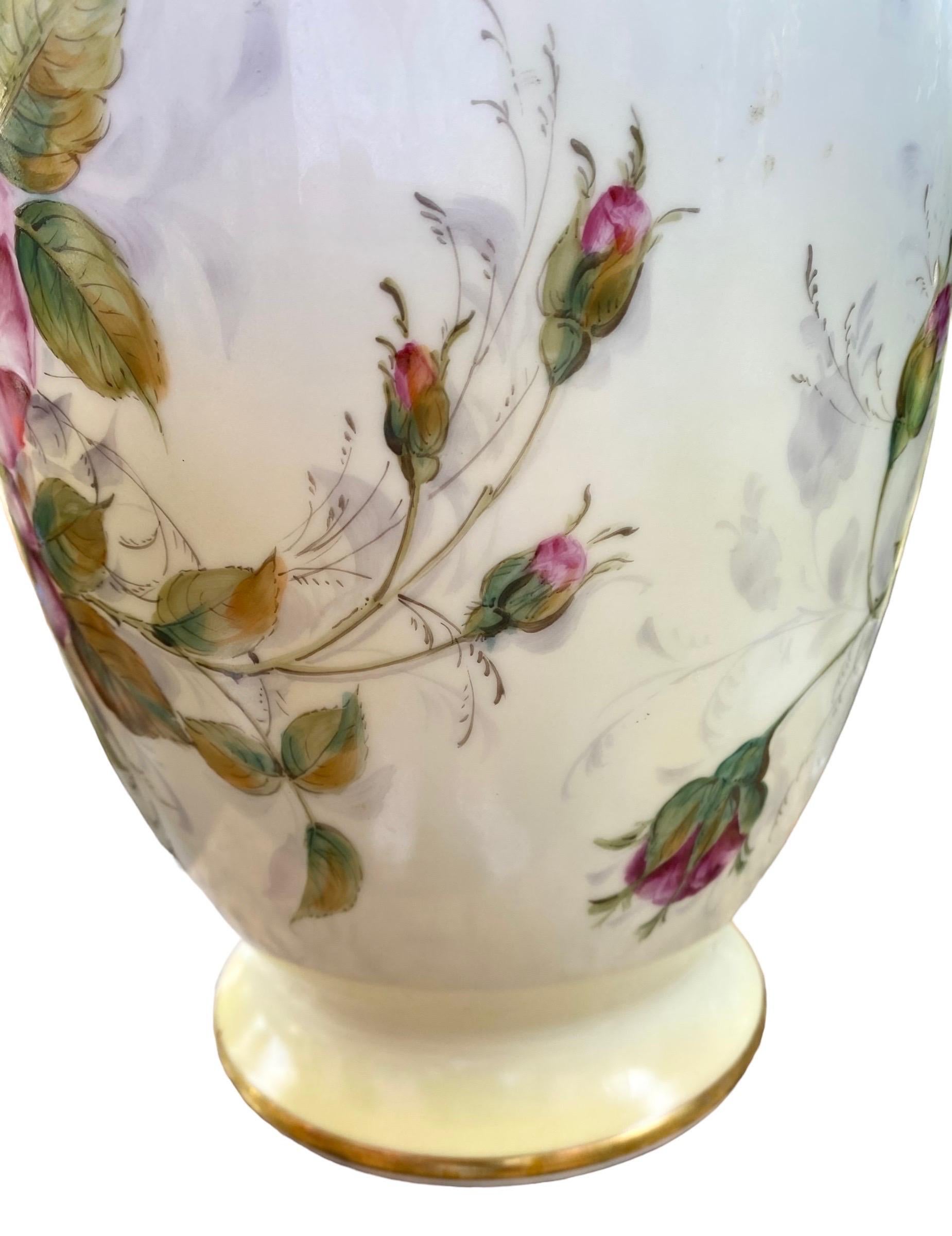 Limoges hand painted red roses antique vase. Outstanding artwork on the roses on this large Limoges antique vase. It is eleven inches tall and nine inches wide. Because the vase is so thick it has a much larger presence than what its dimensions