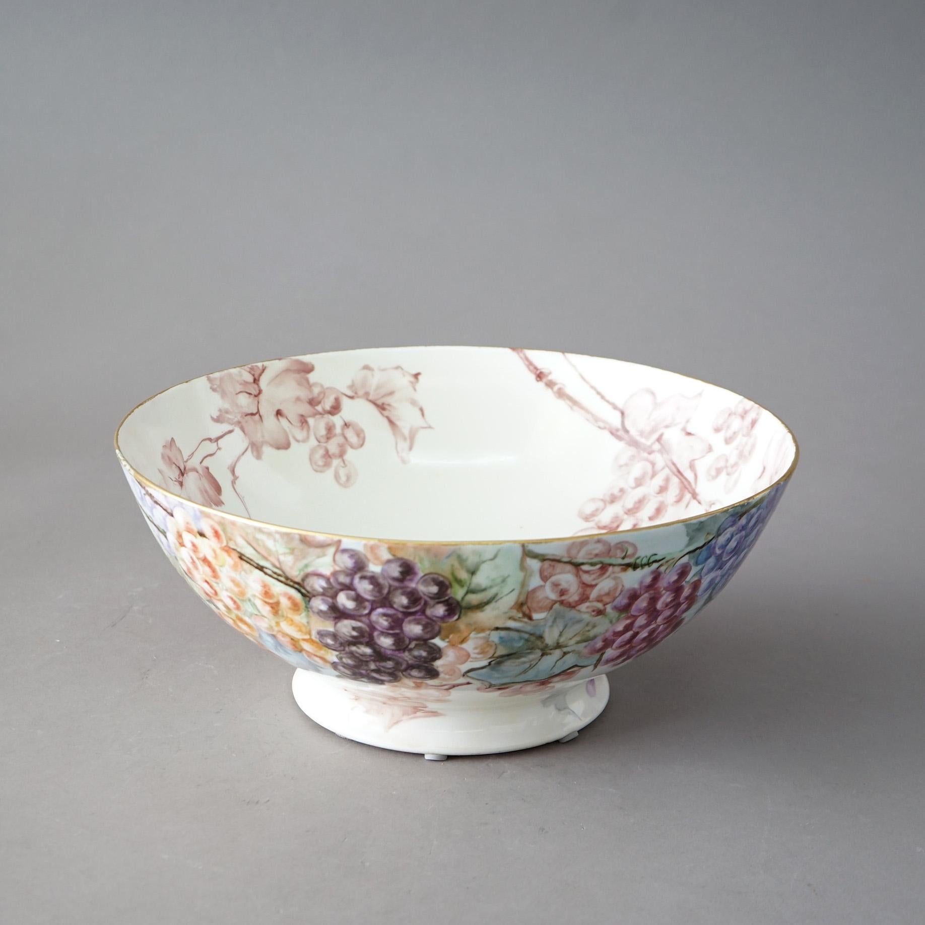 An antique French Limoges center bowl offers porcelain construction with hand painted floral, grape & spider web design, c1900

Measures - 6.25