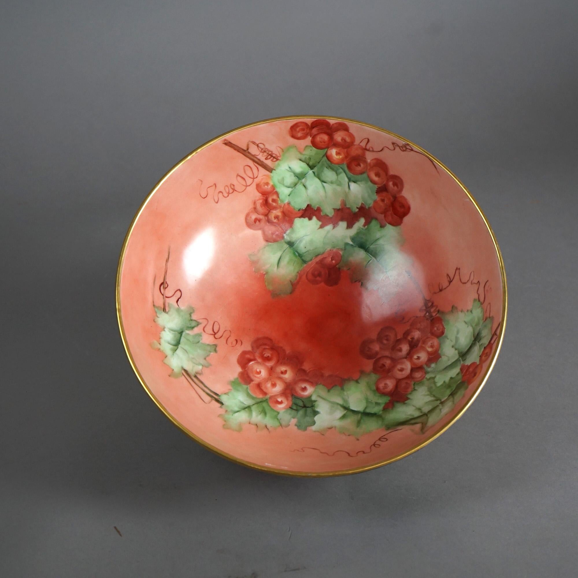 An antique French Limogés punch bowl by Tressemann & Vogt offers porcelain construction with hand painted grape and vine decoration, gilt highlights throughout, en verso T&V maker stamp, and raised on base with scroll form feet, c1900


Measures-