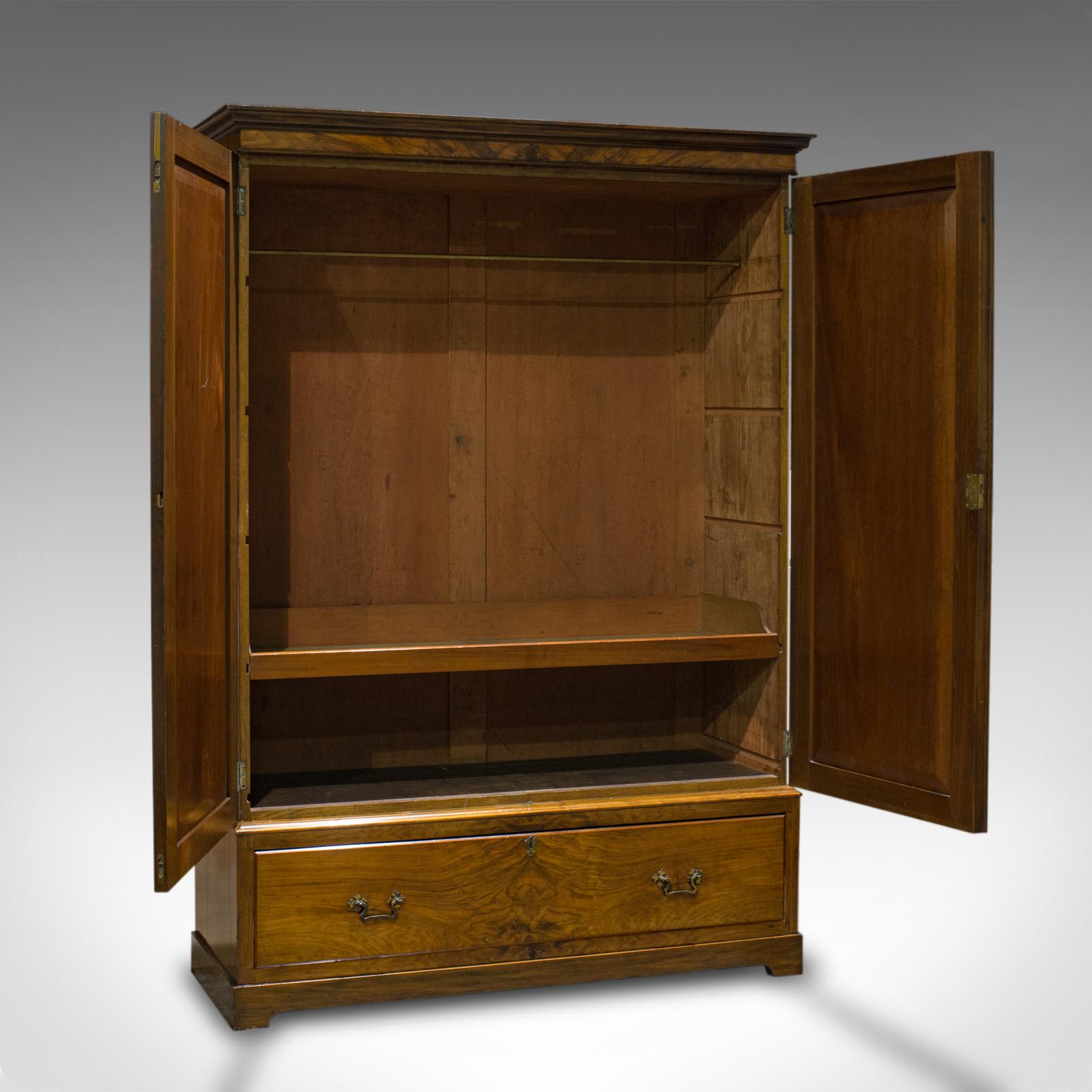 This is an antique linen press. A French, walnut wardrobe with hanging rail and dating to the late 19th century, circa 1900.

Classic proportion and continental Elan
Displays a desirable aged patina and lustre
Select walnut shows wonderful grain