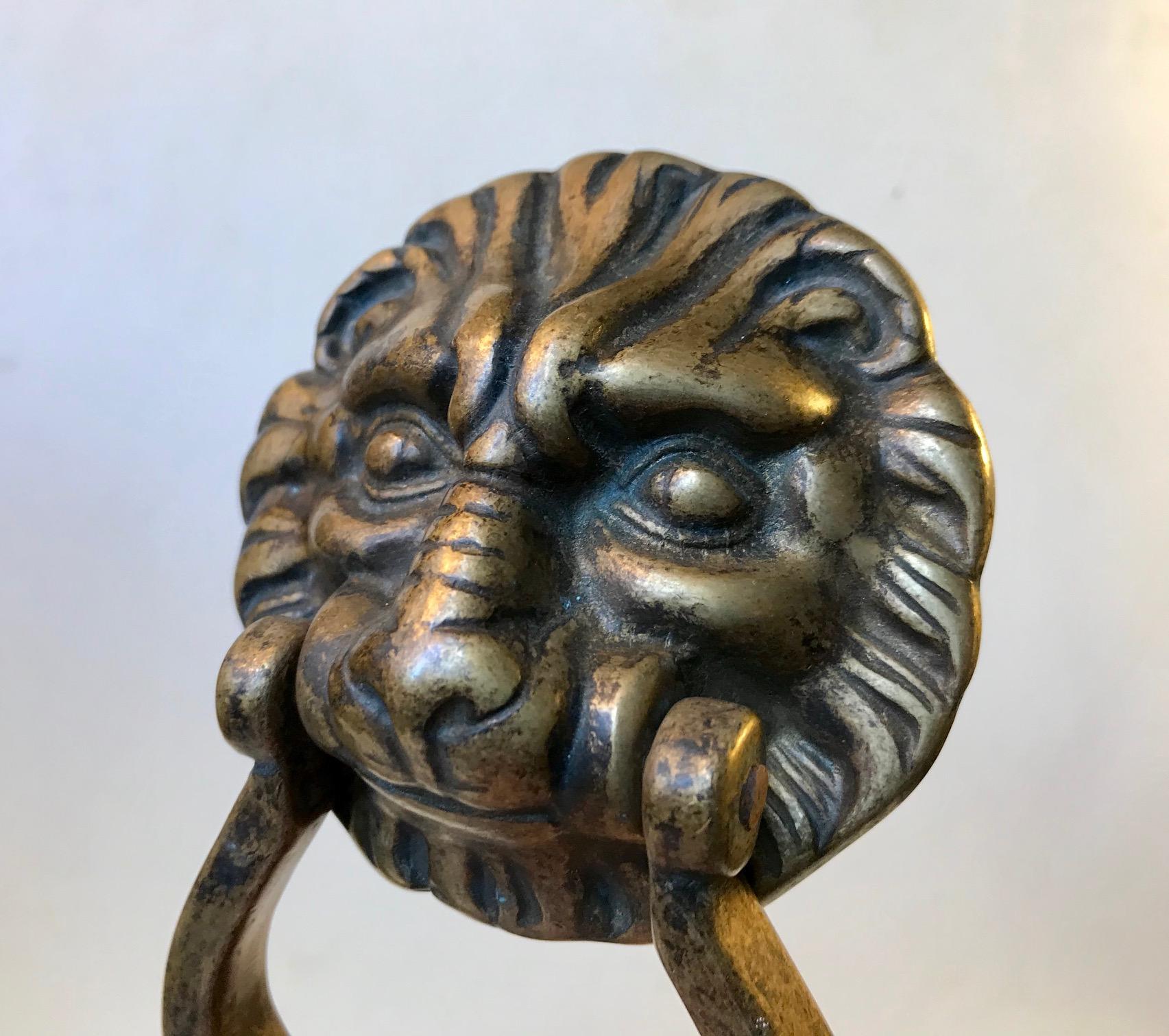 Detailed and well-patinated door knocker in brass. Manufactured in Europe, probably, Greece during the early to mid-20th century. 3 new screws for installation are included.