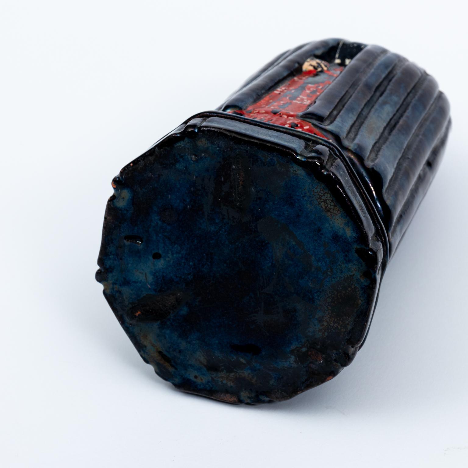 Large cape covered antique liquor bottle composed of pottery to represent the 