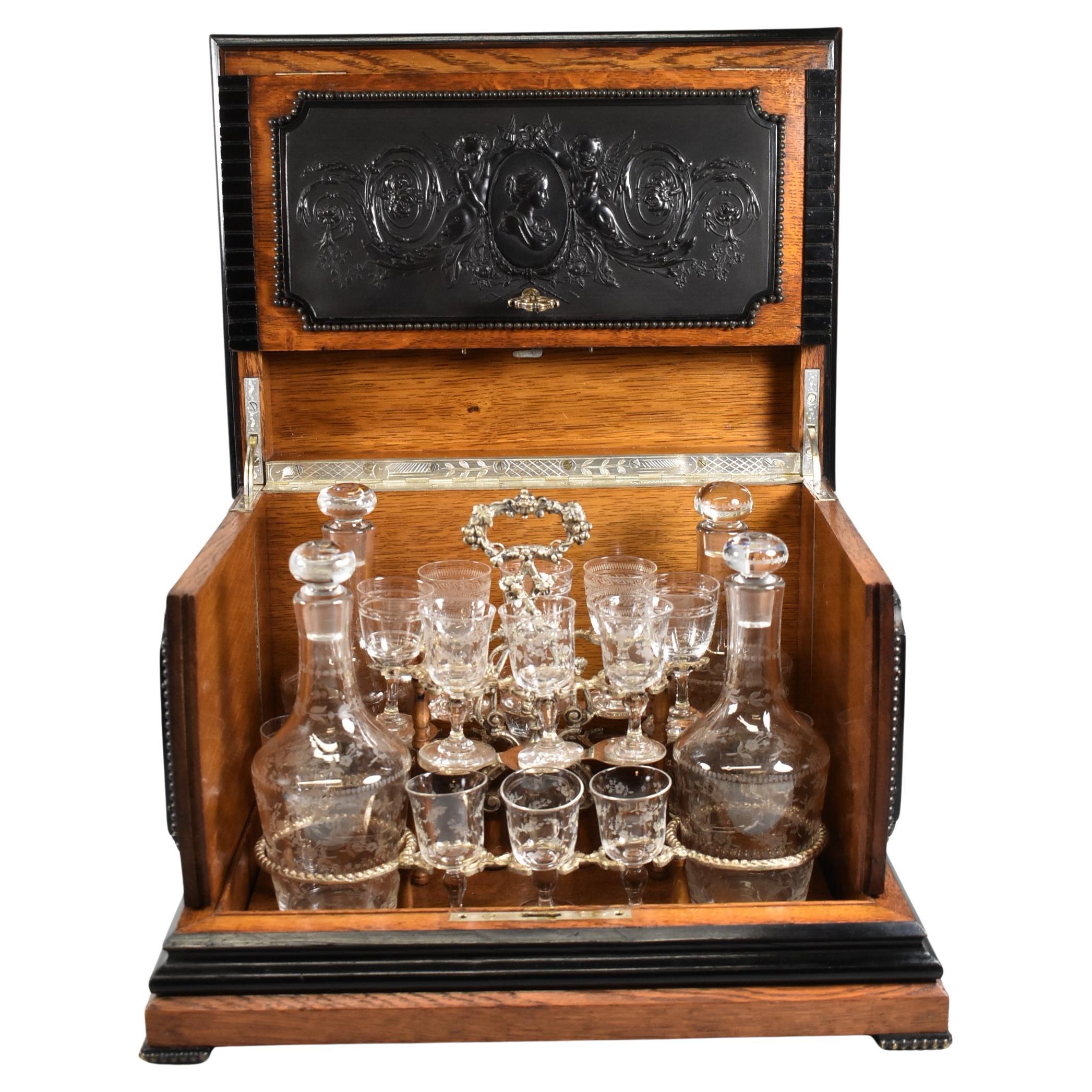 Antique Liquor Tantalus Box Oak With Guta Percha Images Cut Crystal Stemware