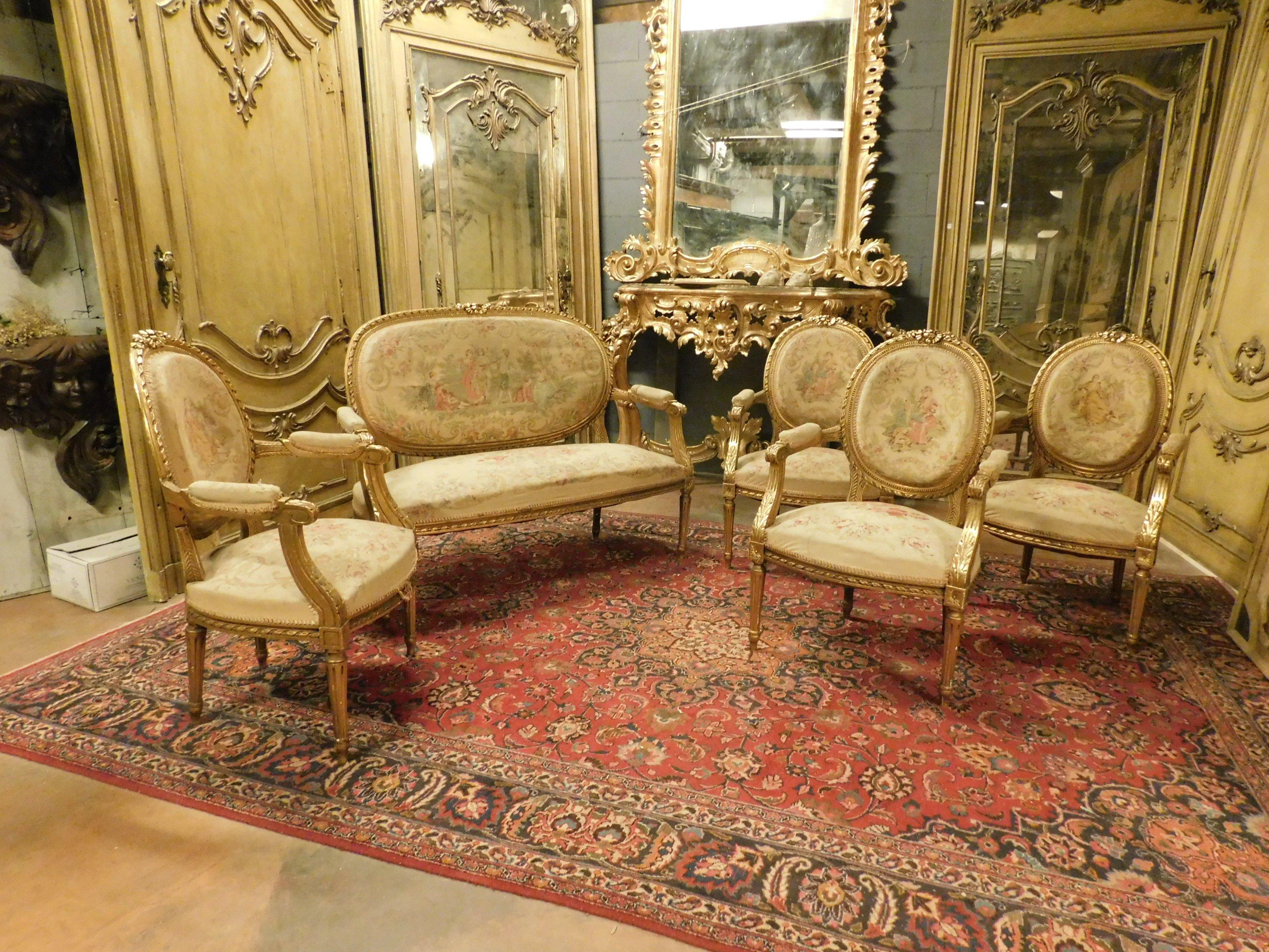 Ancient living room consisting of four armchairs and a sofa, built with a gilded wooden frame and still original fabric in excellent condition, built in the second half of the 19th century in France.
Coming from a period building of great value,