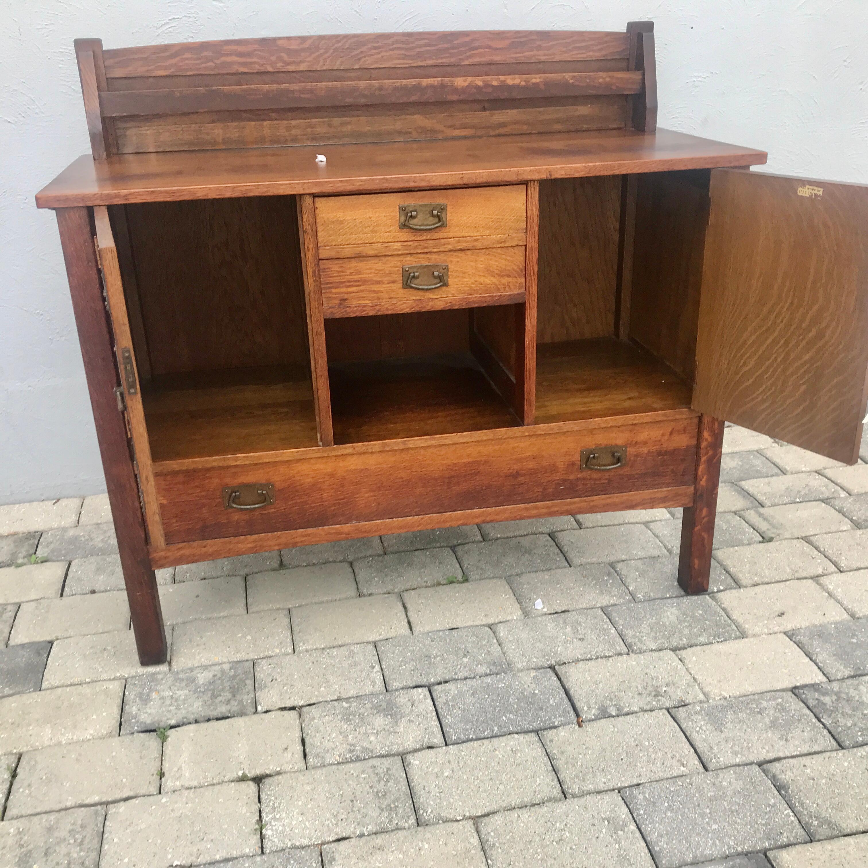 This is an antique PERIOD Arts & Crafts Sideboard Model #708 by L&JG Stickley FROM Early 1900s.. This piece has the original hardware,, original finish, and a great selection of oak.  90% of the pieces like this have wood damage on the sides, but