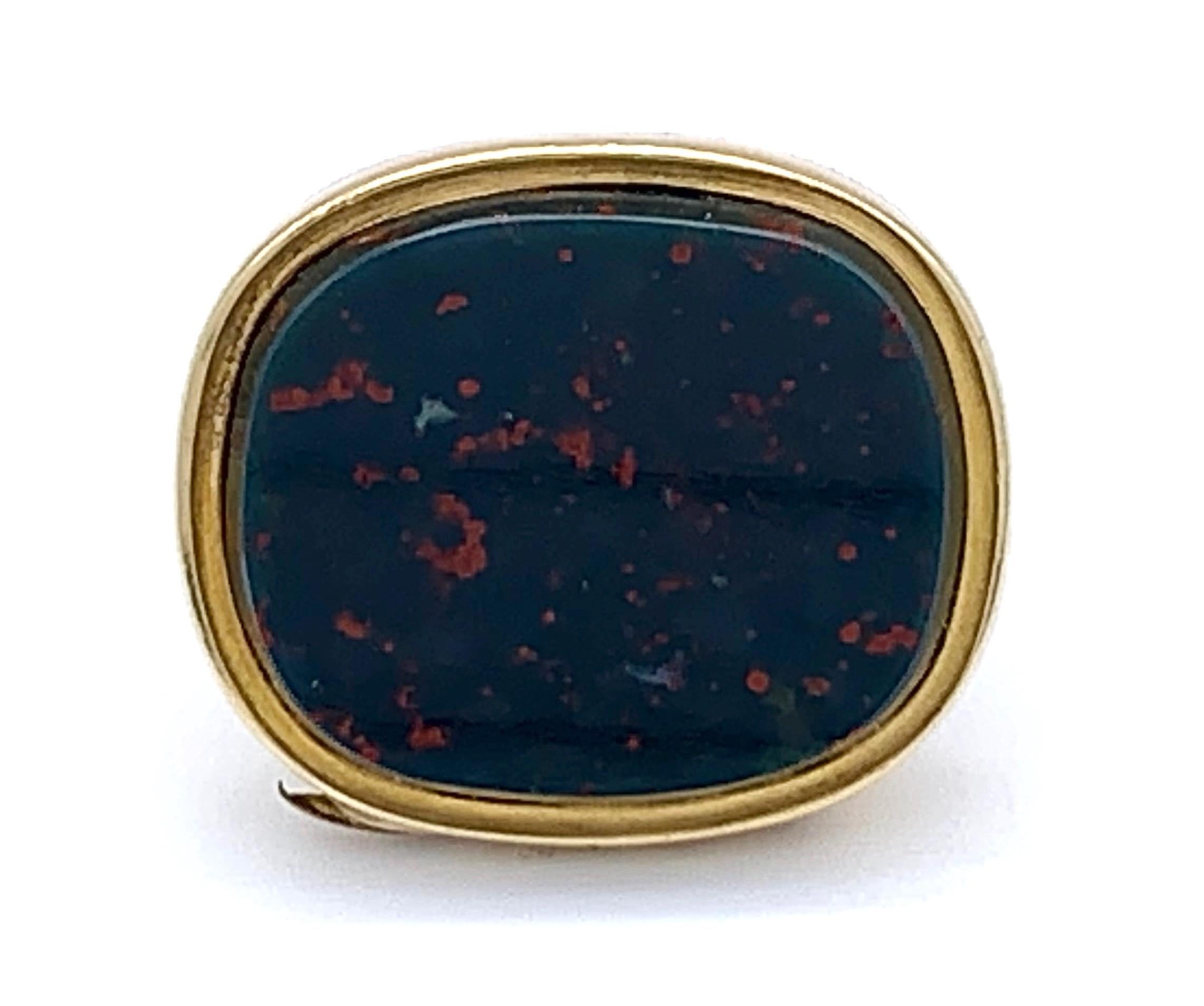 Unusual gold seal that has been designed as a locket. The unused base is made out of a hinged gold mounted bloodstone. The top of the locked is decorated with a carefully chiselled and engraved flower and leaves in two colour gold.