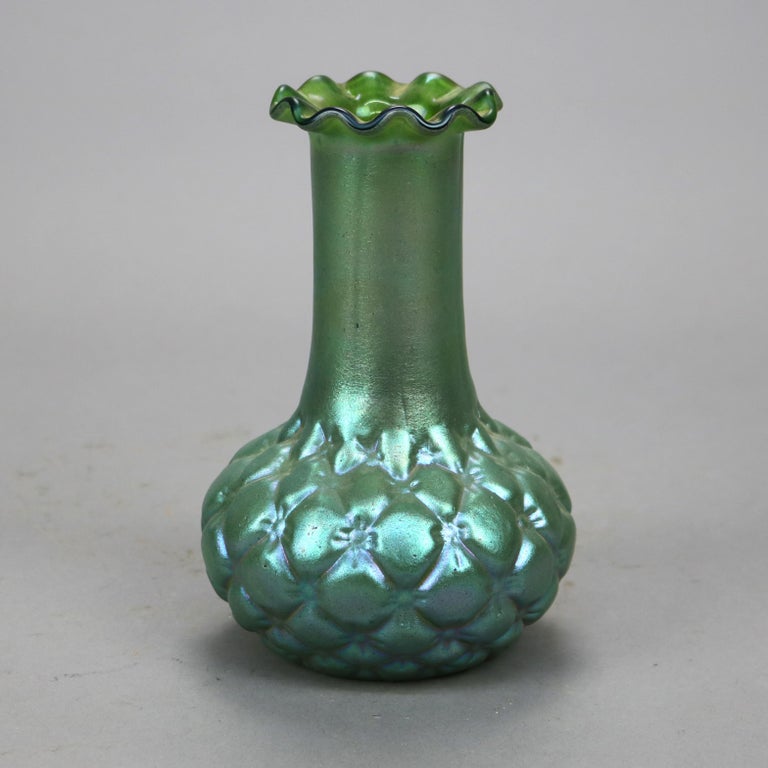 An antique vase by Loetz offers green art glass construction with bulbous squash bottom and ruffled rim, unsigned, c1930

Measures- 7.25''H x 4.5''W x 4.5''D.

Catalogue Note: Ask about DISCOUNTED DELIVERY RATES available to most regions within
