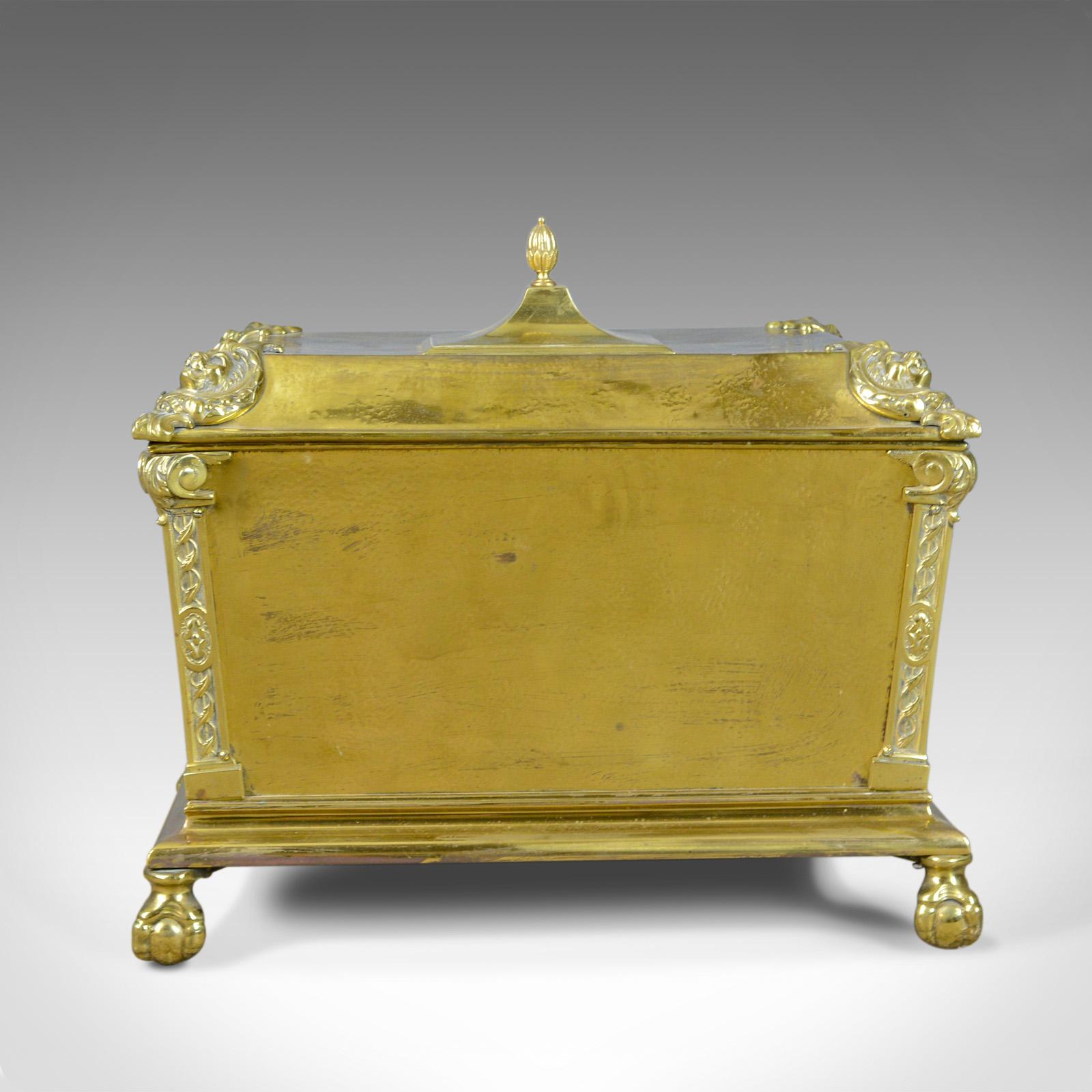 This is an antique log bin, a brass fireside storage box for kindling, logs, coal or ash. An English, Victorian fireplace accessory dating to the late 19th century, circa 1880.

A pleasing, mid-size fireside storage bin in brass
Of classical