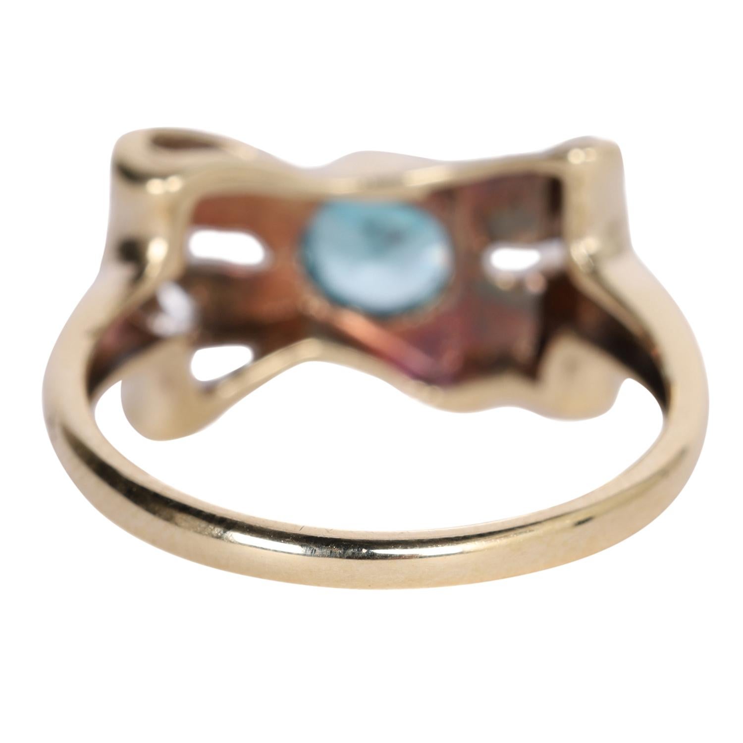 Antiguo anillo LONDON de topacio azul y nudo de diamantes en venta 1