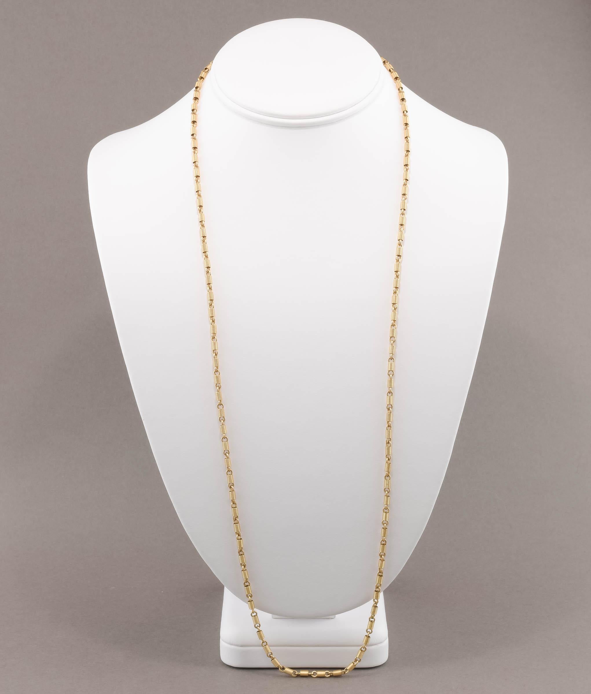 Offered is a wonderful fancy link long gold chain dating to the late 19th century - early 20th century.  

Crafted of solid 14K yellow gold, the fancy style links look like tightly coiled springs - not a very easy to find style, especially in this