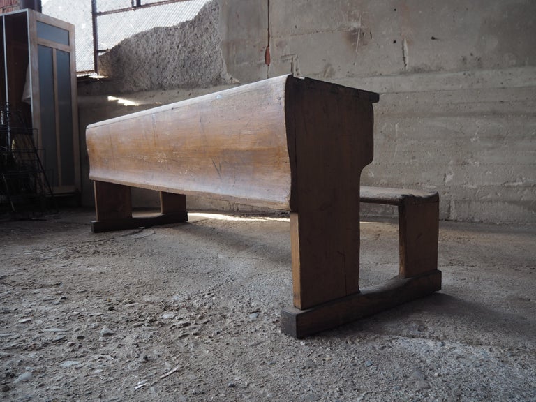 Long vintage all-wood bench from an elementary school in former Czechoslovakia from 1930s with its original paint.