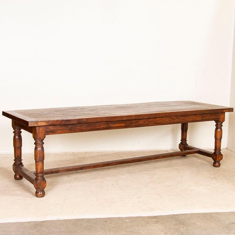 Impressive in size, this 8.5' long library or refectory table will make a dramatic dining table and gathering place in today's modern home. The large oak table reveals generations of use as seen by typical scratches, knicks, crack along the top,