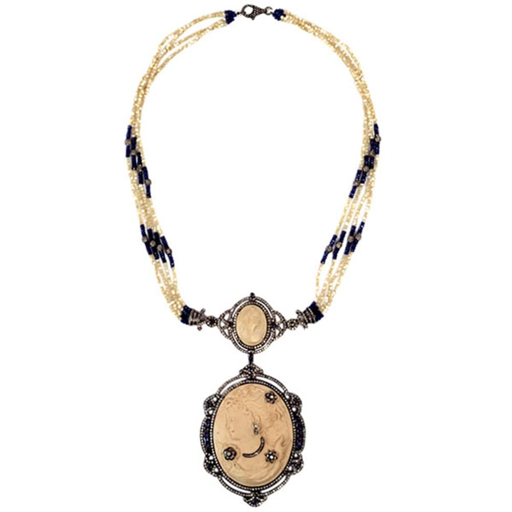 Antique looking cameo necklace with MOP and Sapphire Beads and Diamonds set in 18K Gold and silver, is lovely and takes you back to Victorian Era. We have matching earrings to this also.


18kt Gold: 0.83gms
Diamond: 8.09cts
Silver: 32.94gms
Cameo: