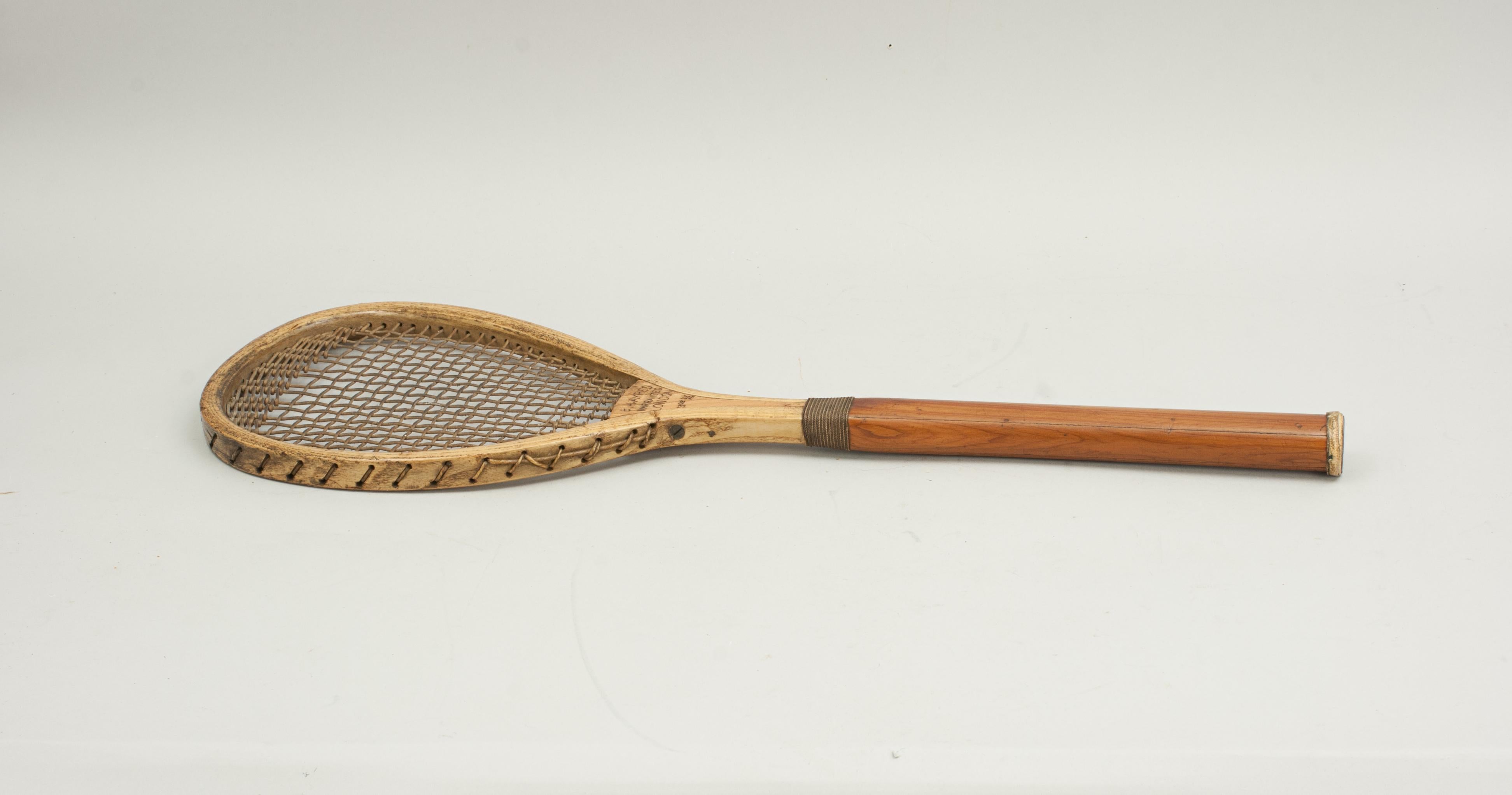 Antique F.H. Ayres Lawn Tennis Racket.
A rare, early lopsided (tilt head or teardrop shape) lawn tennis racquet in good original condition by F.H. Ayres of London. The heavy ash lop-sided frame is in very good condition, the wedge with slight