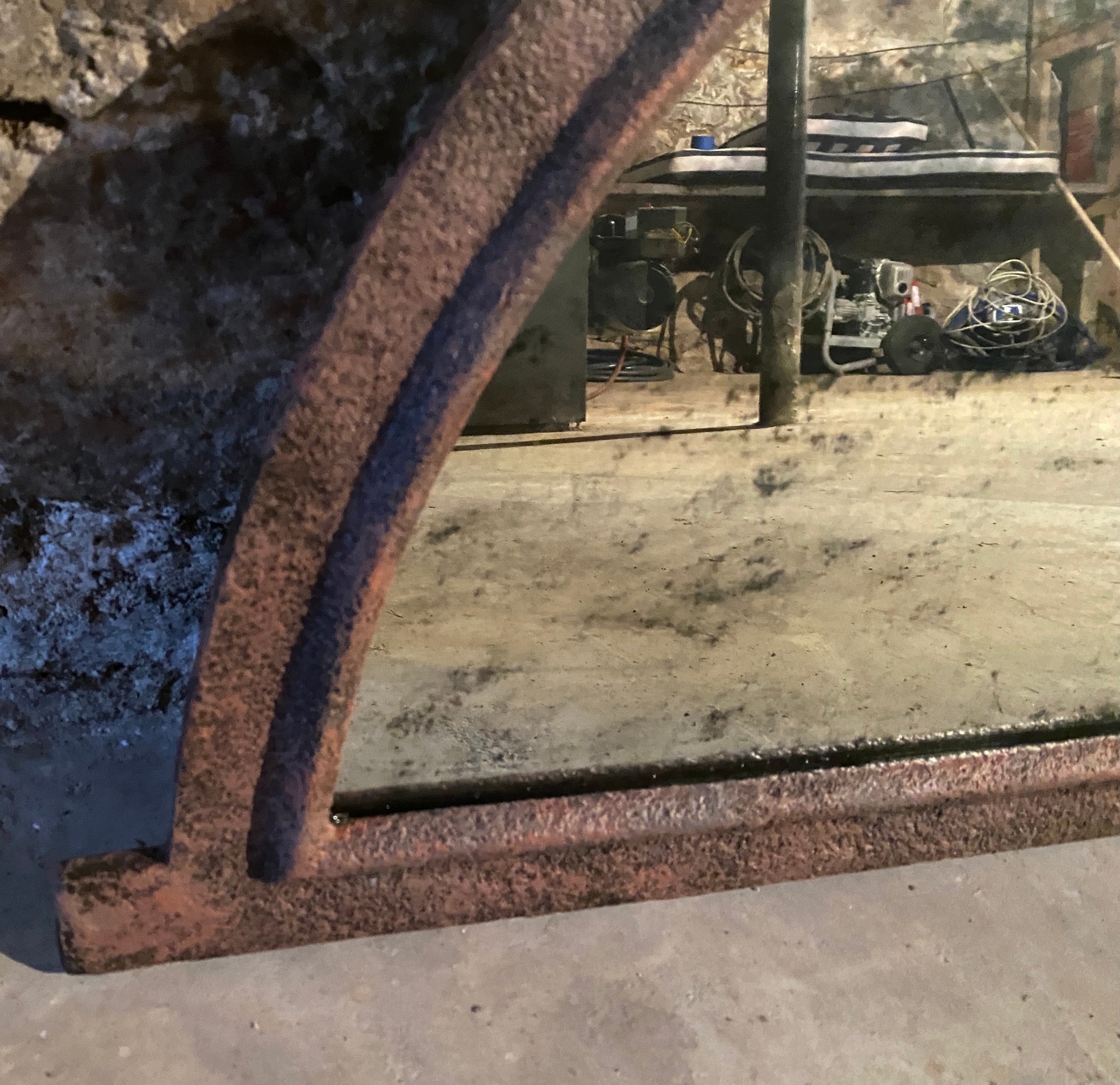 An unique size and shape antique Neo-classic Tuilleries Orangerie 37 x 19 h metal wall mirror with half round top made of hand crafted cast iron antique frame  that once was a window from French chateau with inserted mirrored panels. The mirror
