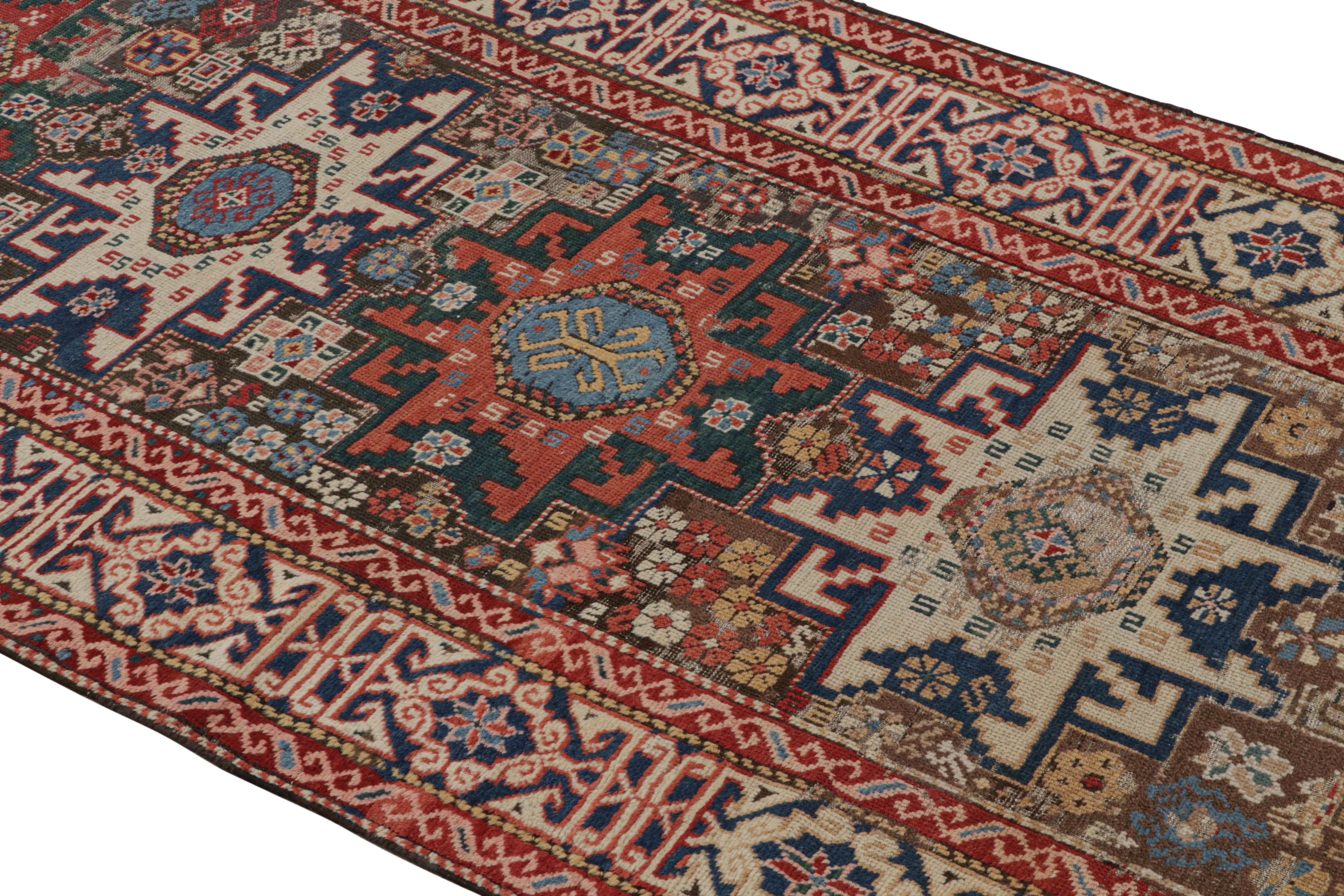 Originating from Russia in 1900, this antique geometric runner depicts a lightly distressed Lori design, complemented by a series of eight-pointed star, hook, and quarter-diamond Gul motifs. Hand knotted in high quality wool, the mirrored hooking