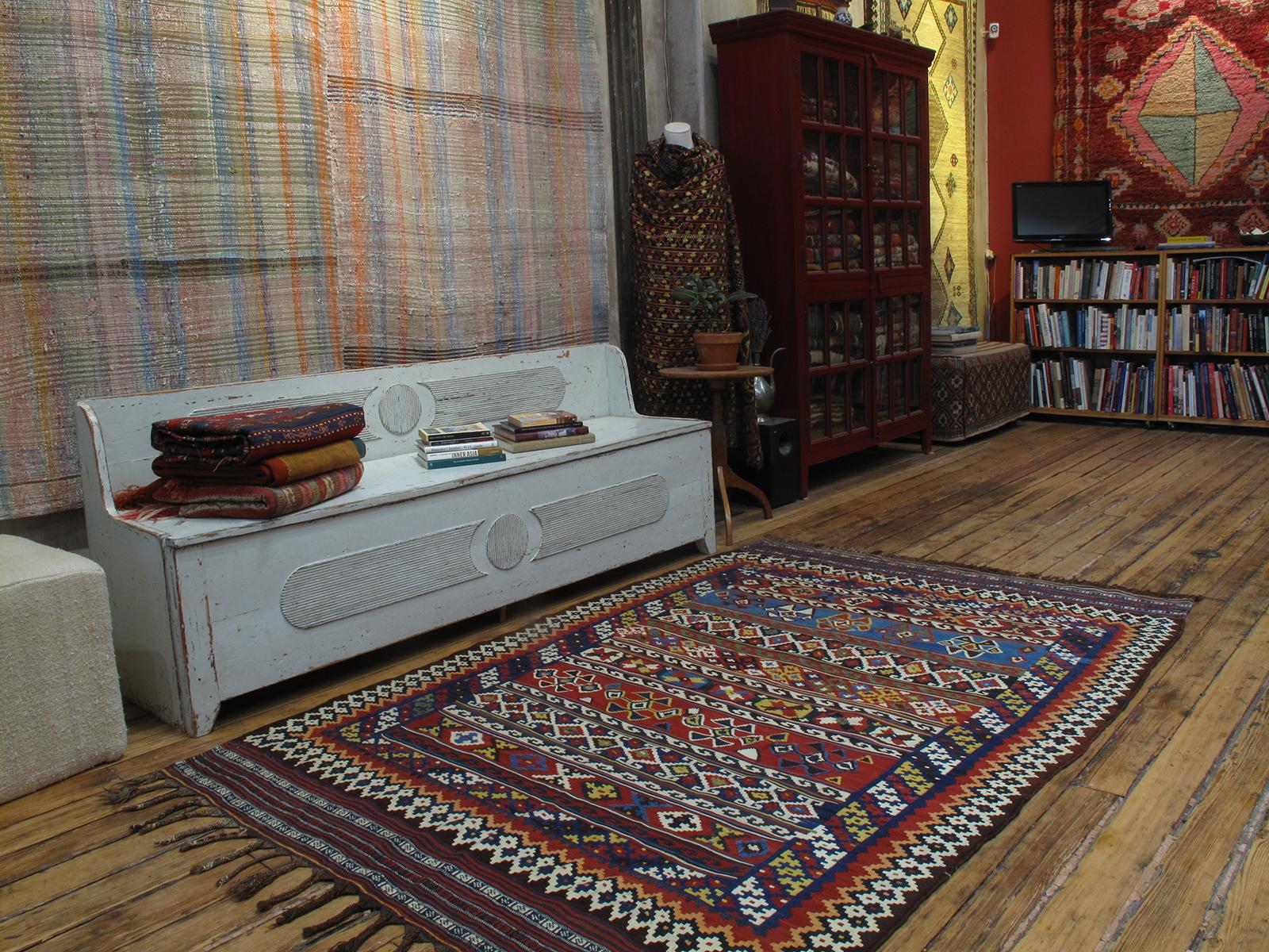 A beautiful antique kilim from Southwestern Iran, attributed to the Lori tribes, displaying one of their classic designs in a lively color palette of natural dyes. In remarkable state of preservation, retaining its original finishes all around.