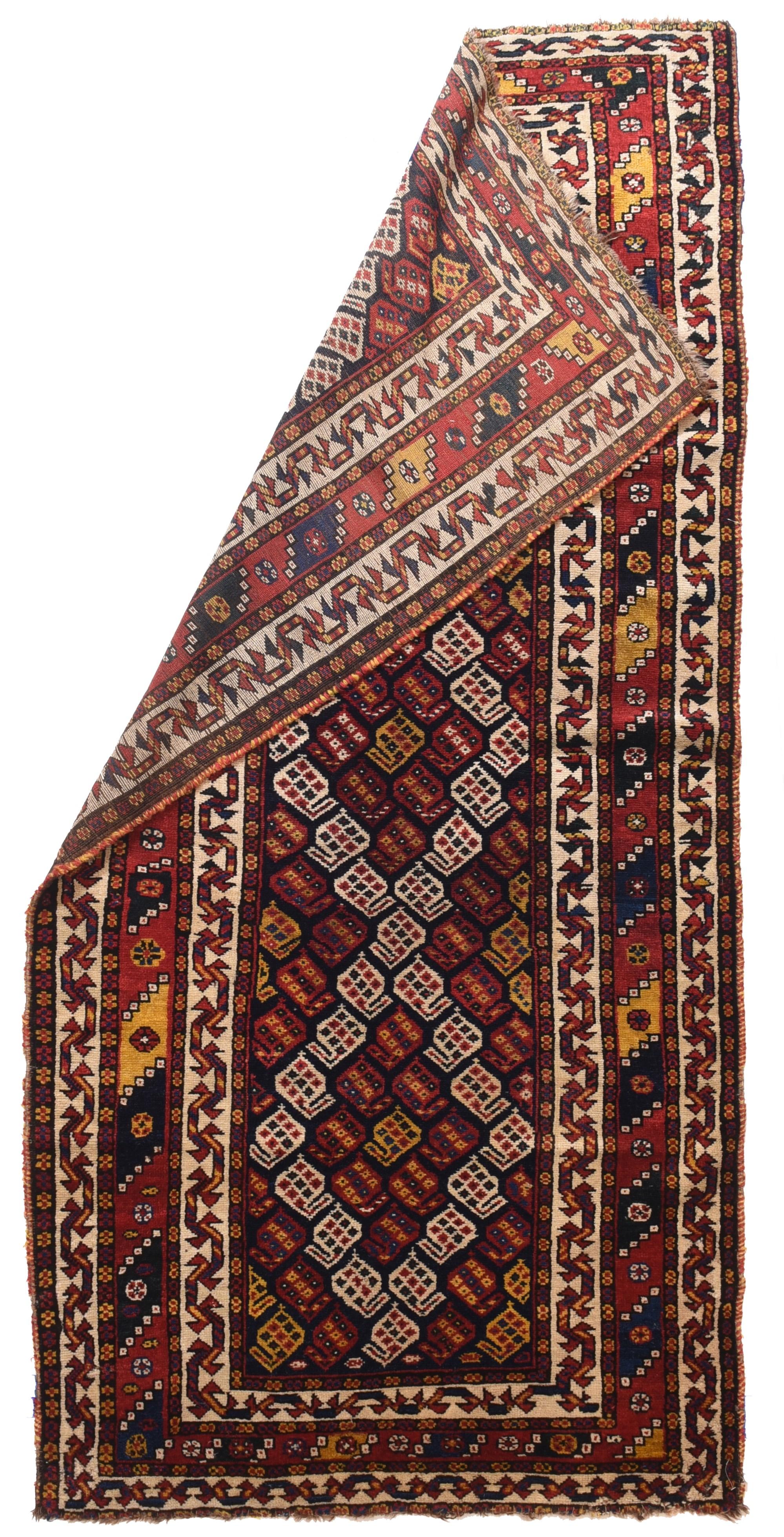 Antique Lori Tribal Rug 3'10'' x 7'8''. From SW Persia, and from either the Luri or Khamseh tribal groups, this well-coloured, naturally paletted piece shows a row reversing boteh pattern with a three connected lozenge over-pattern in ivory. Botehs