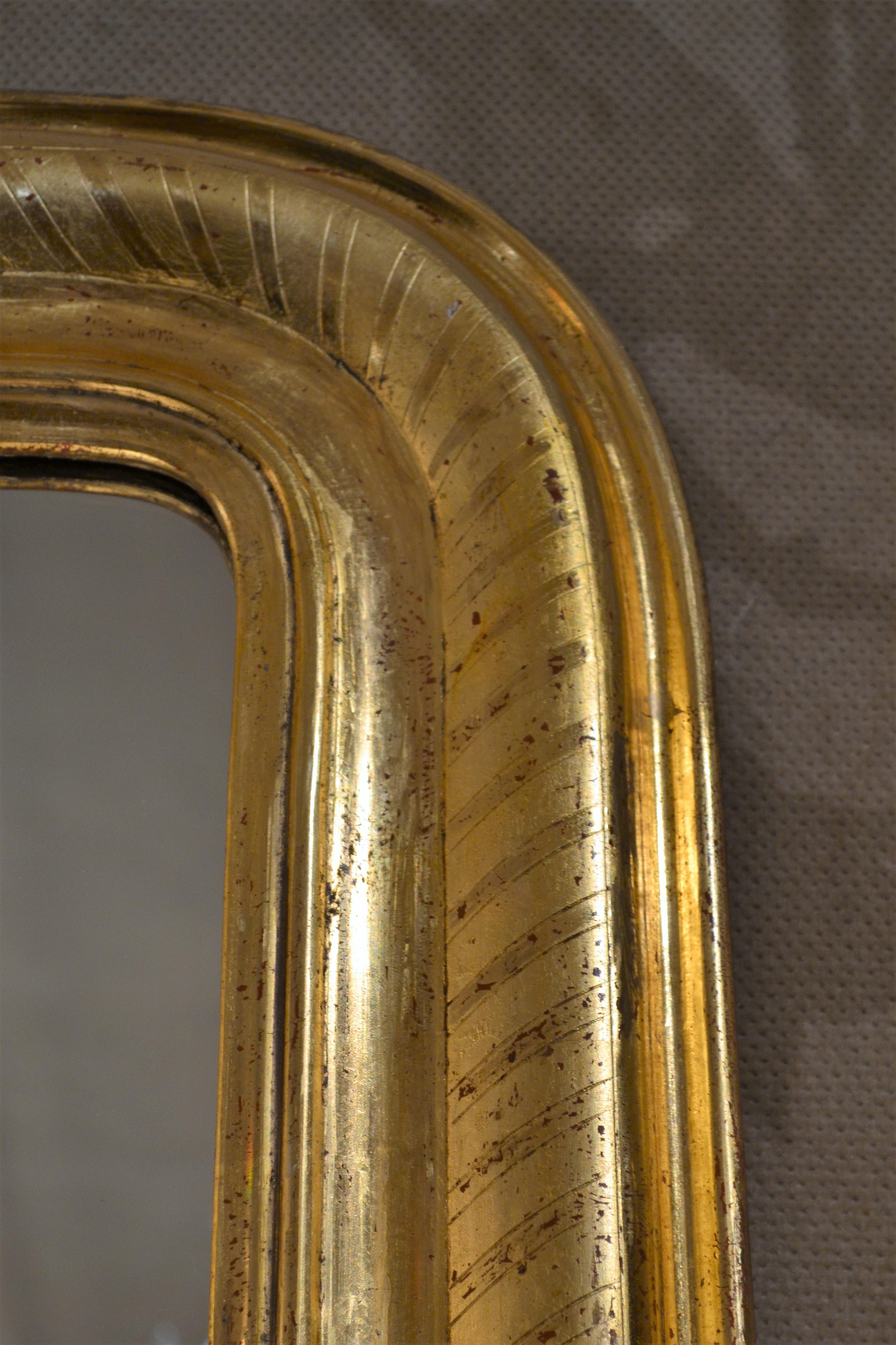 This is a lovely mirror. There are minor losses in the gold leaf which can easily be repaired.