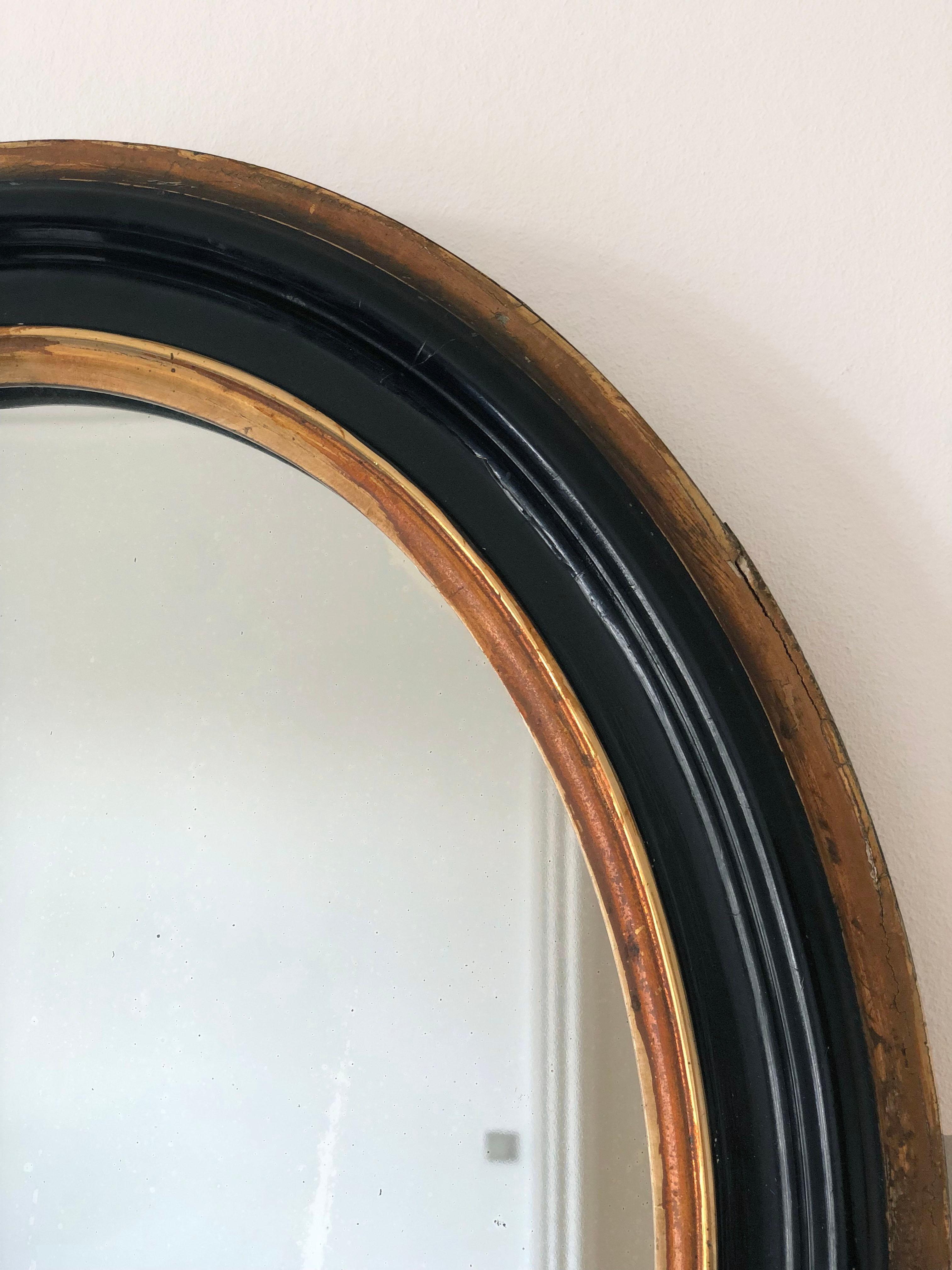 Gilt Antique Louis Philippe Oval French Mirror in Black and Gold Late 19th Century For Sale