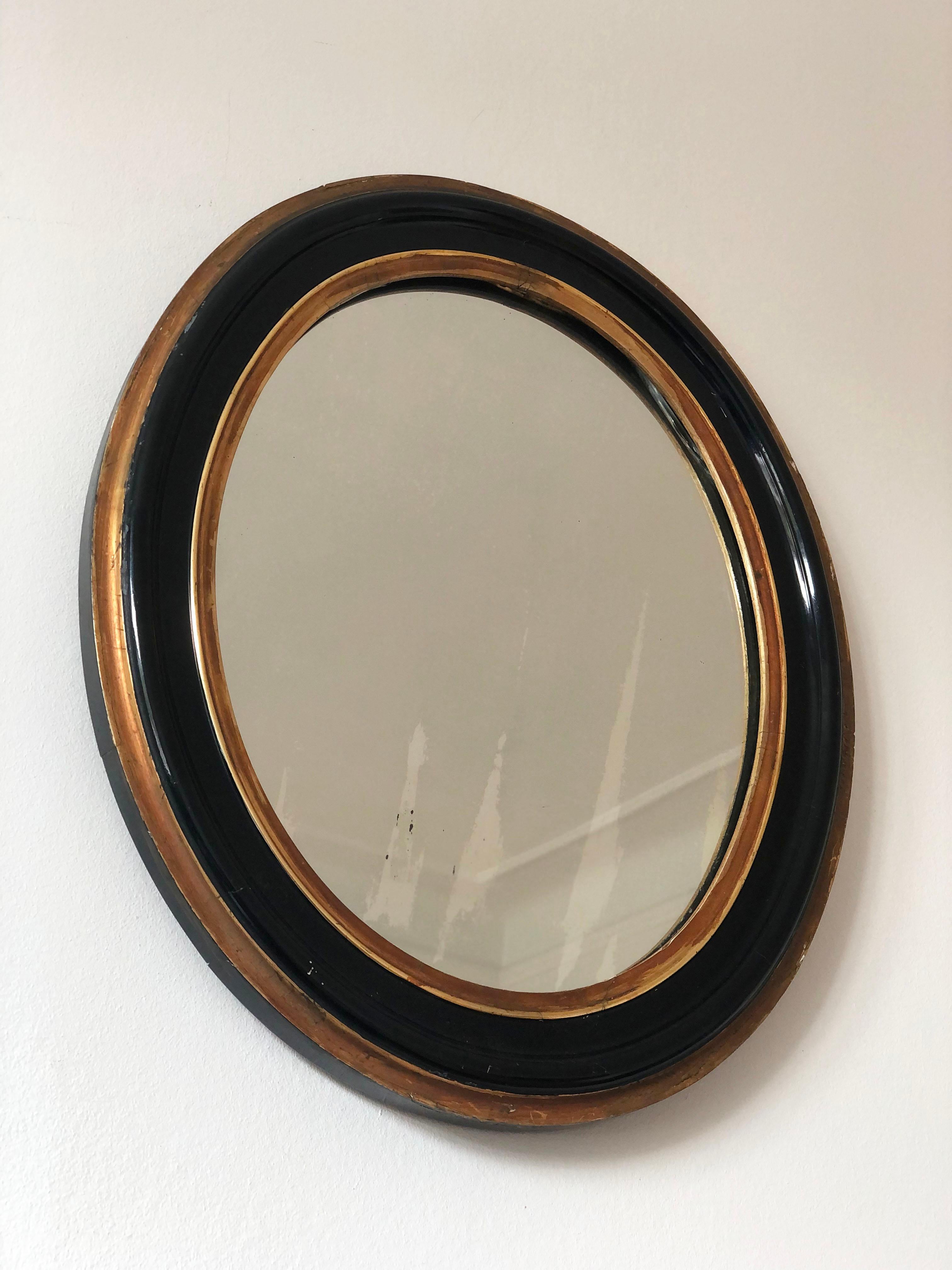 Mercury Glass Antique Louis Philippe Oval French Mirror in Black and Gold Late 19th Century For Sale