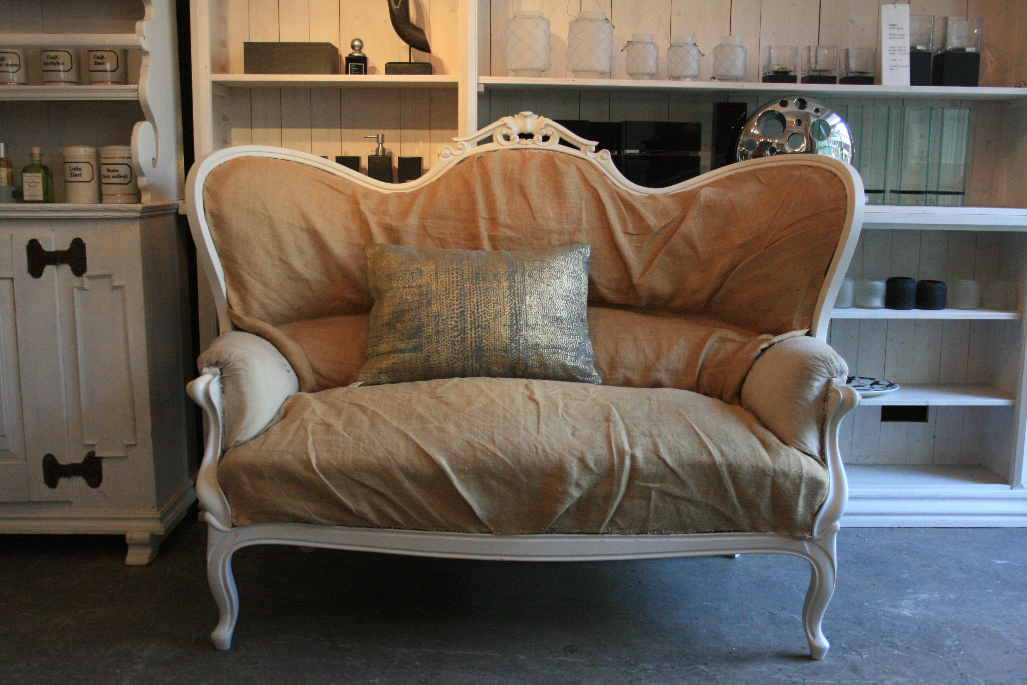 Antique French Louis-Philippe sofa from circa 1840 with curved legs. The frame of the sofa is made of oakwood and was completely checked and sanded by us, and then painted in 