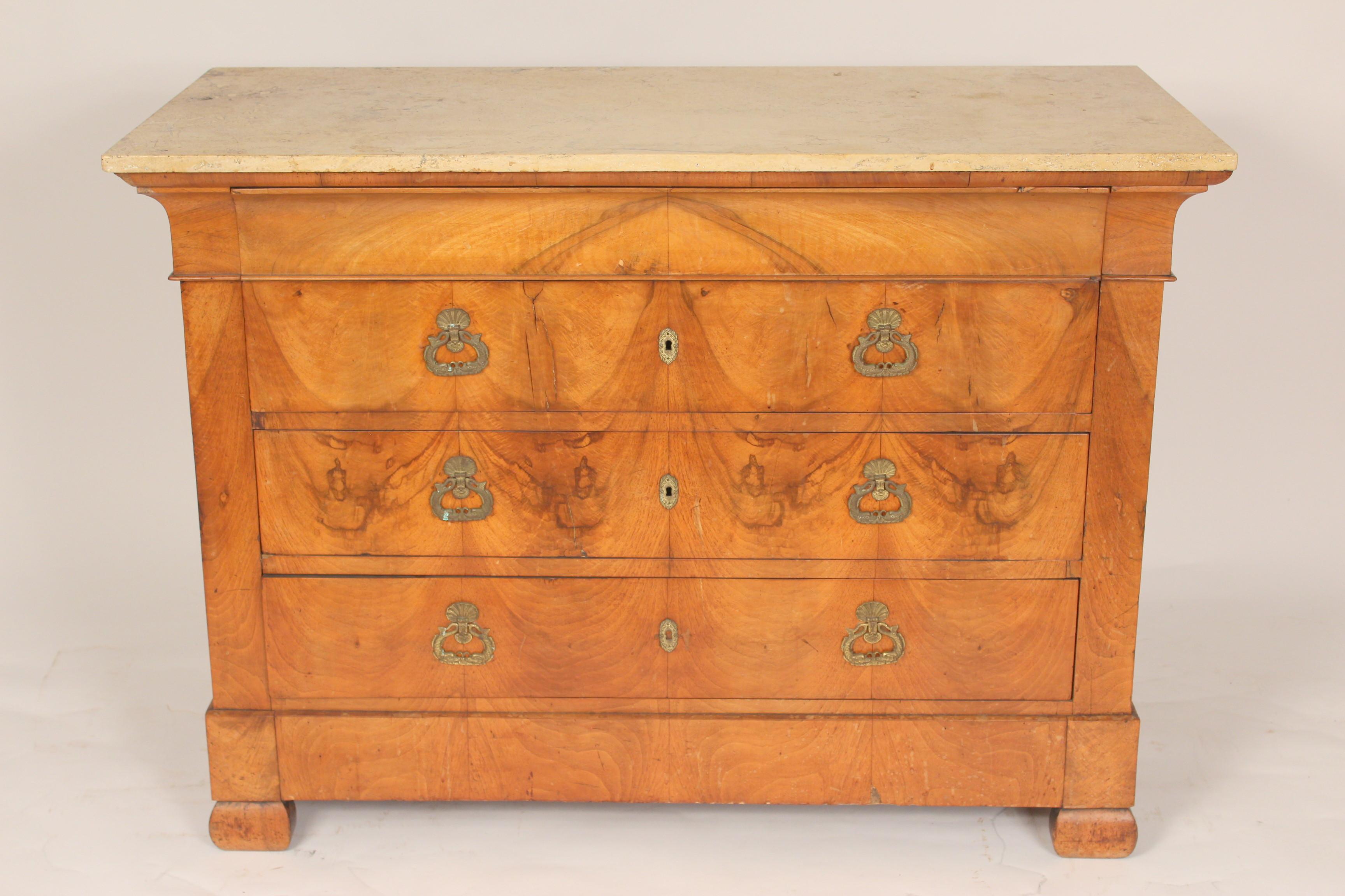 Antique Louis Philippe burled chest of drawers with a later marble top, circa 1850. With interesting book matched burled front and nice quality chased dolphin drawer pulls.