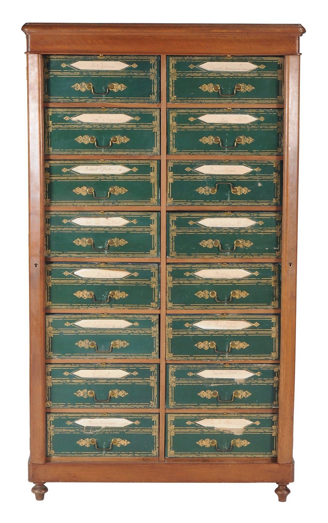 A magnificent Louis Phillipe mahogany and gilt tooled leatherette Cartonnier, circa 1840, of Wellington type, incorporating 16 paper lined drawers, fronted by gilt tooled leatherette fronts incorporating title apertures, on a plinth base and turned